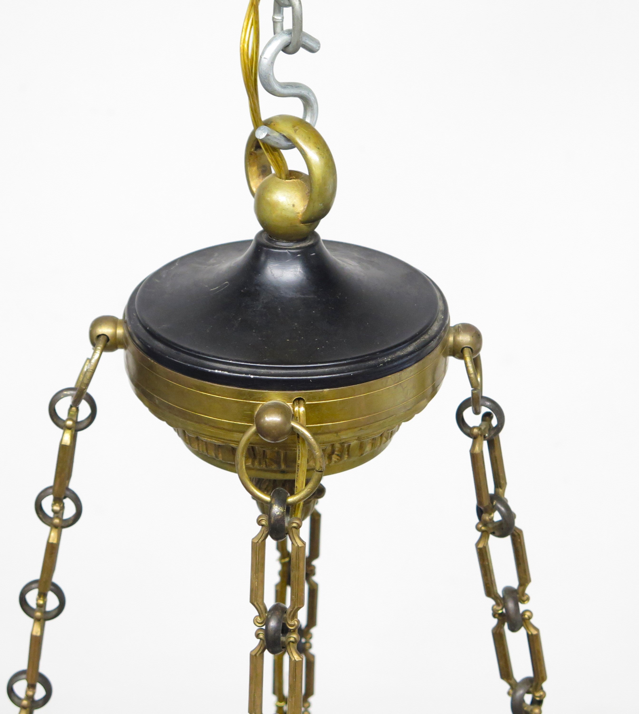 A Charles X Patinated and Gilt Metal Twelve Light Chandelier