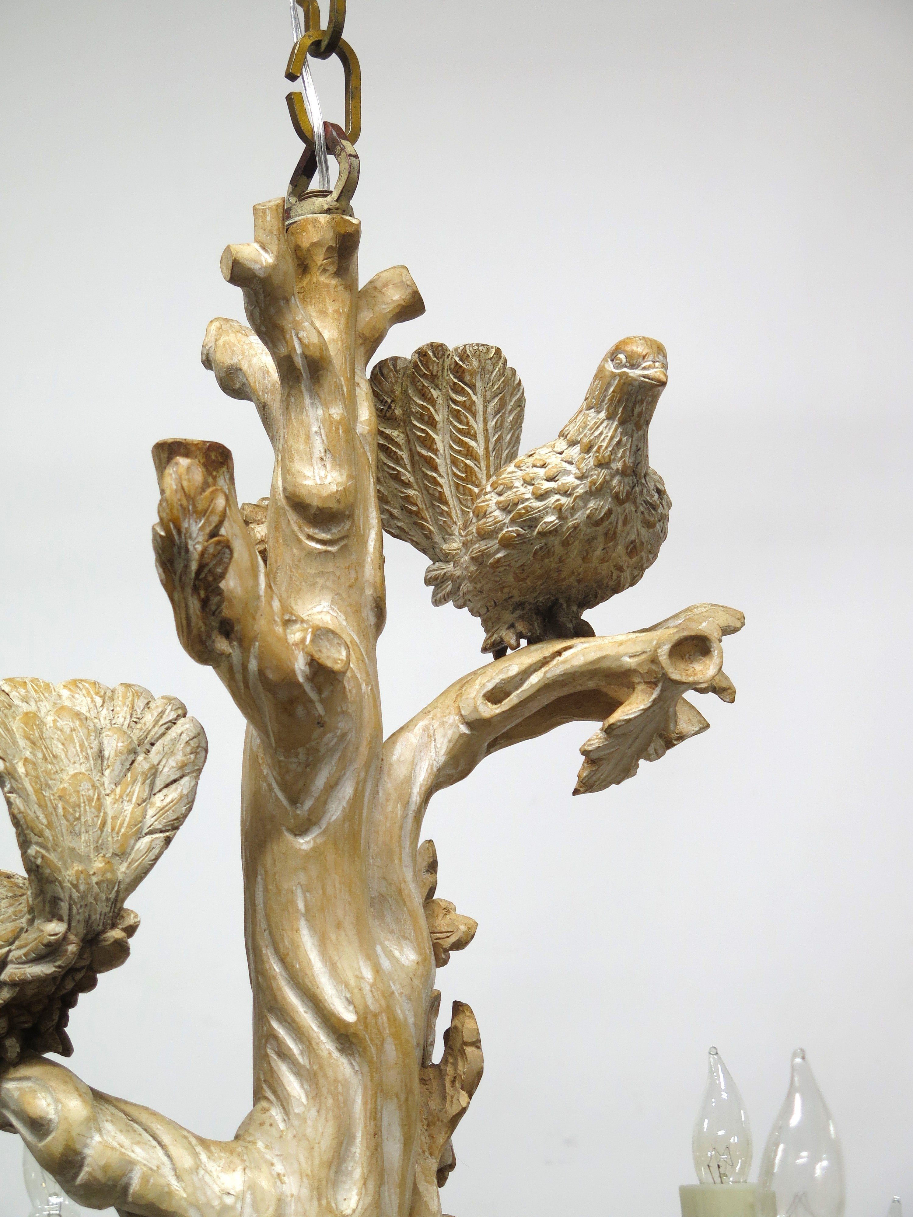 A Carved Italian Faux Bois Pickled Ten Light Chandelier
