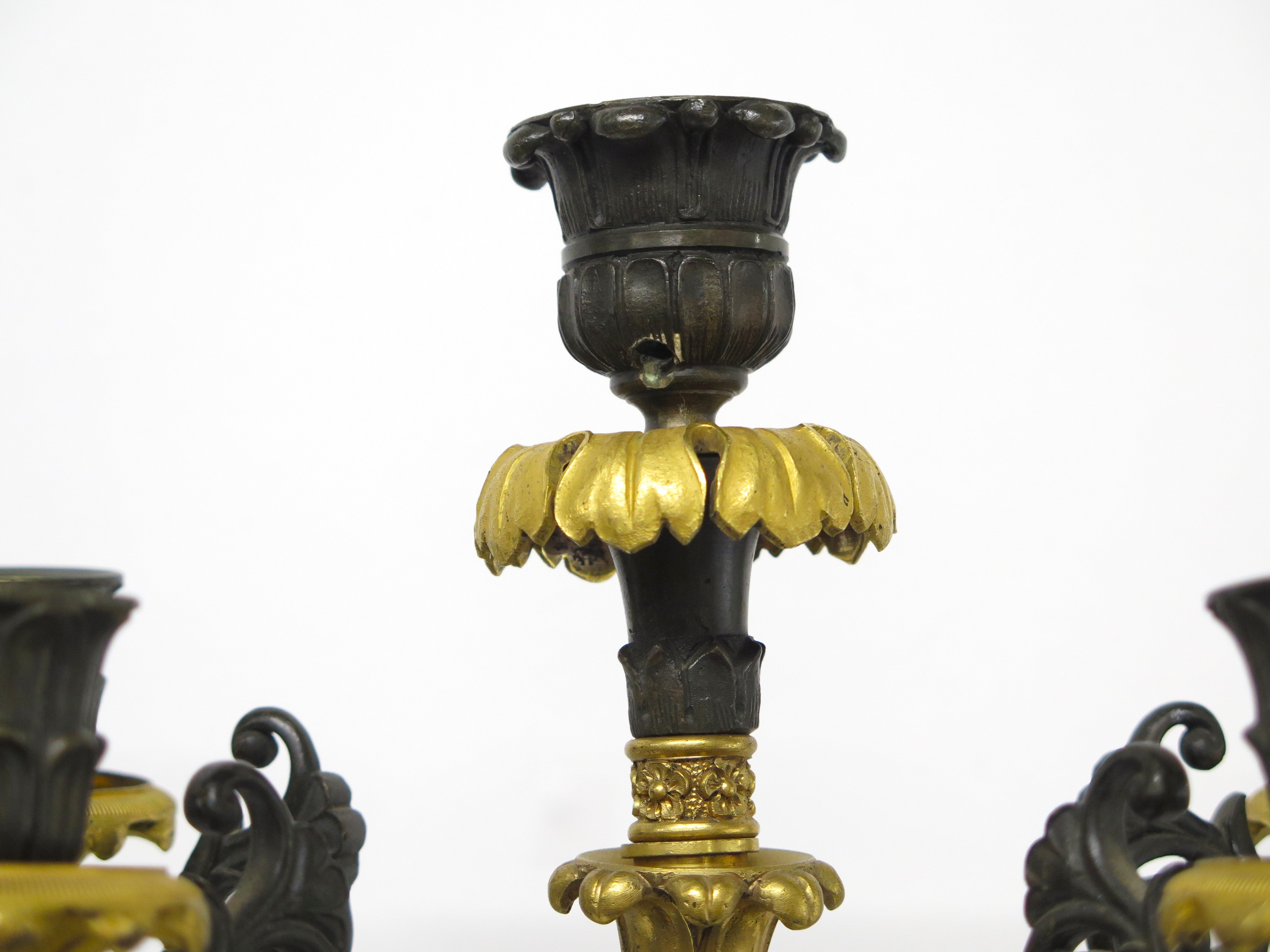 A Pair of Charles X Pattinated and Gilt Five Arm Wall Lights