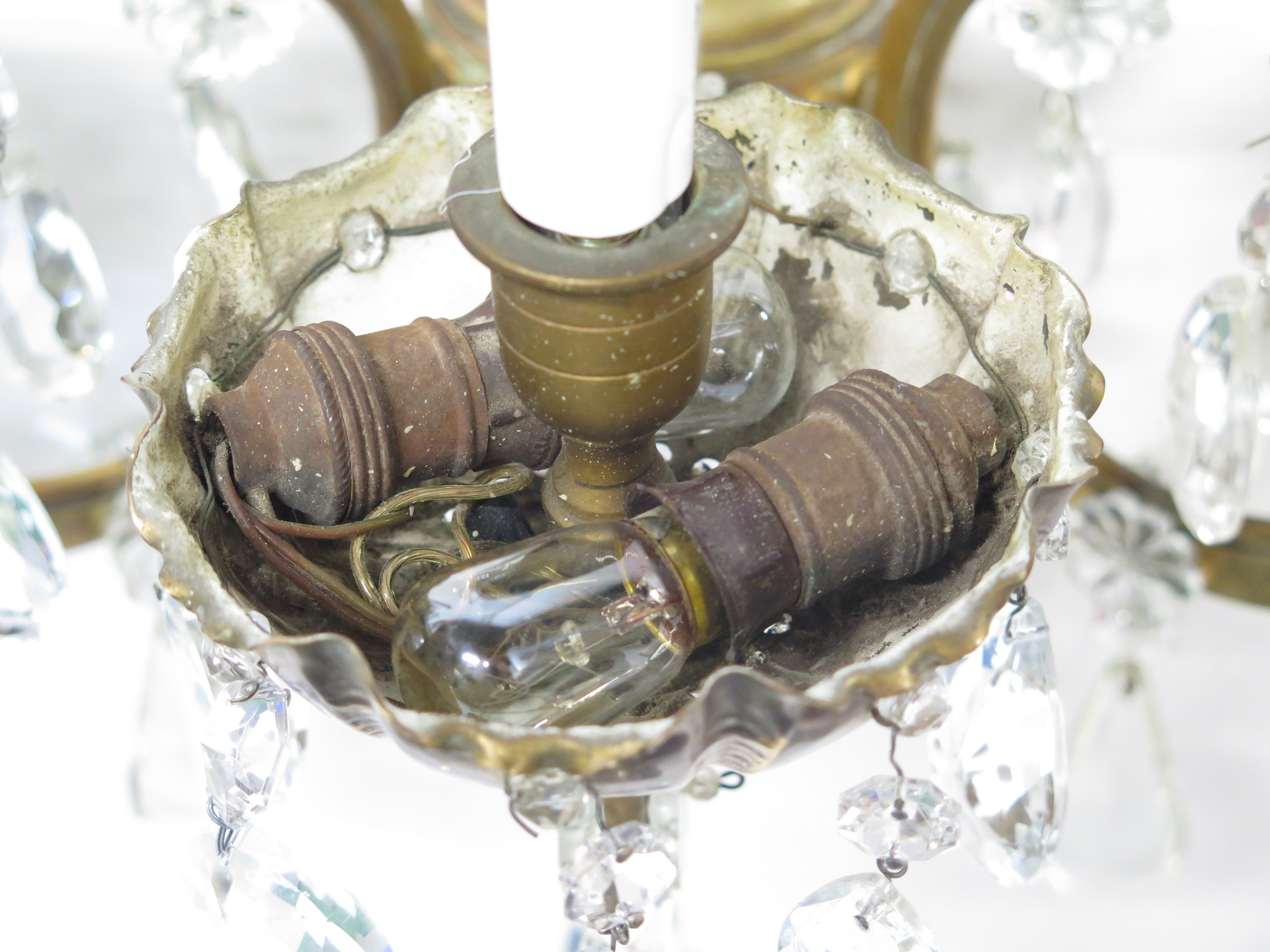 A Pair of Maison Jansen Three Light Bronze and Crystal Sconces
