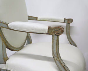 A Pair of 18th Century Paint and Parcel Gilt Italian Arm Chairs