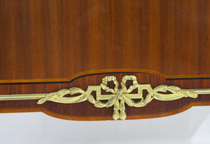 A French Ormolu-mounted Amaranth, Kingwood, Bois Satine, and Burr-amboyna Commode