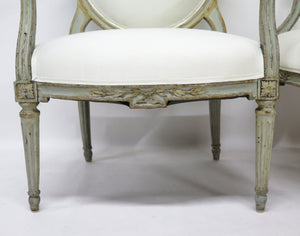 A Pair of 18th Century Paint and Parcel Gilt Italian Arm Chairs