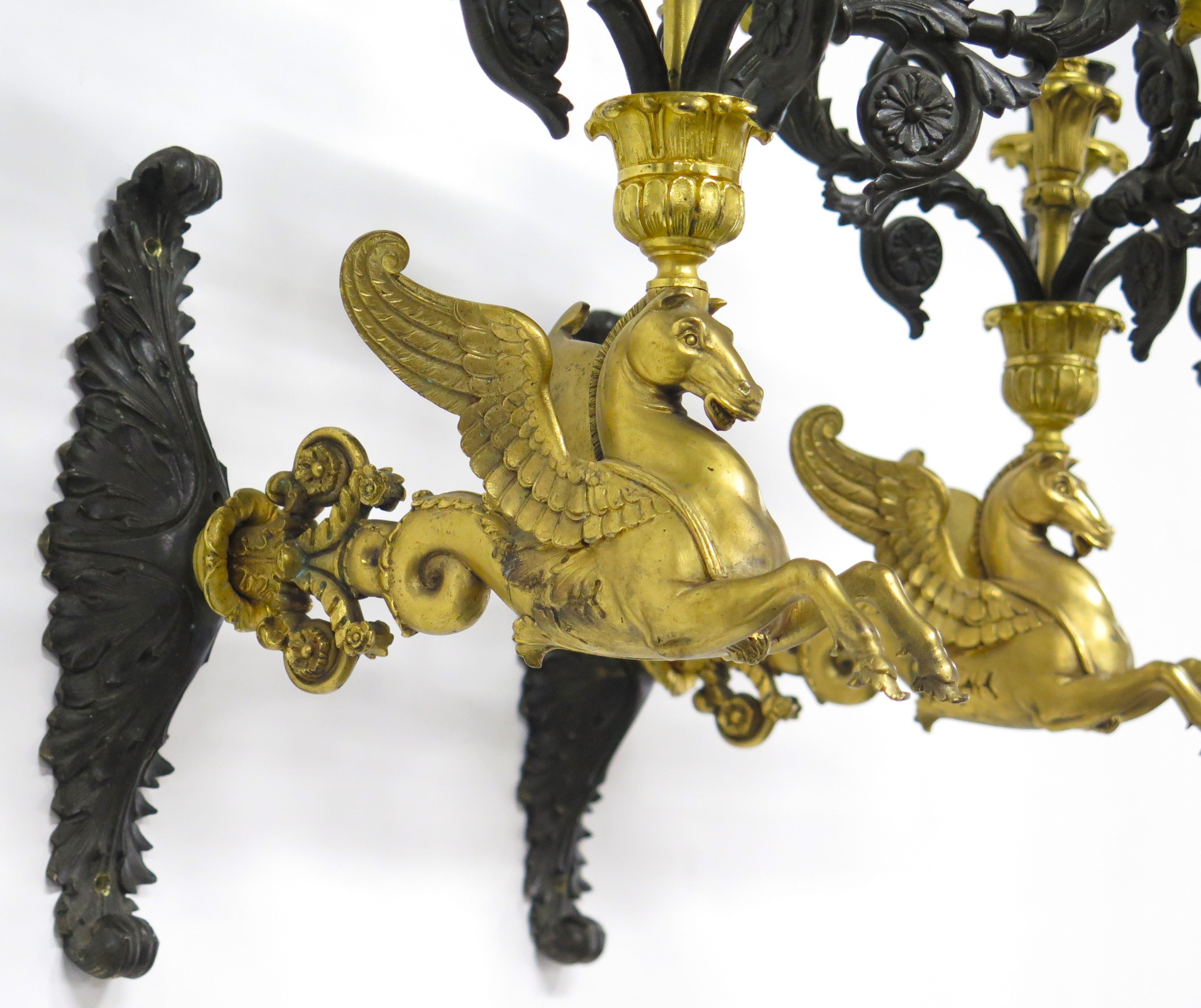 A Pair of Charles X Pattinated and Gilt Five Arm Wall Lights