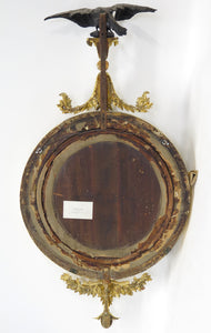 A Superb Early Regency Ebonised and Giltwood Convex Mirror