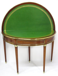 A Beatiful "Near" Pair of Louis XVI Style Mahogany and Brass Mounted Demilune Games Tables