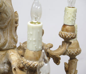 A Carved Italian Faux Bois Pickled Ten Light Chandelier