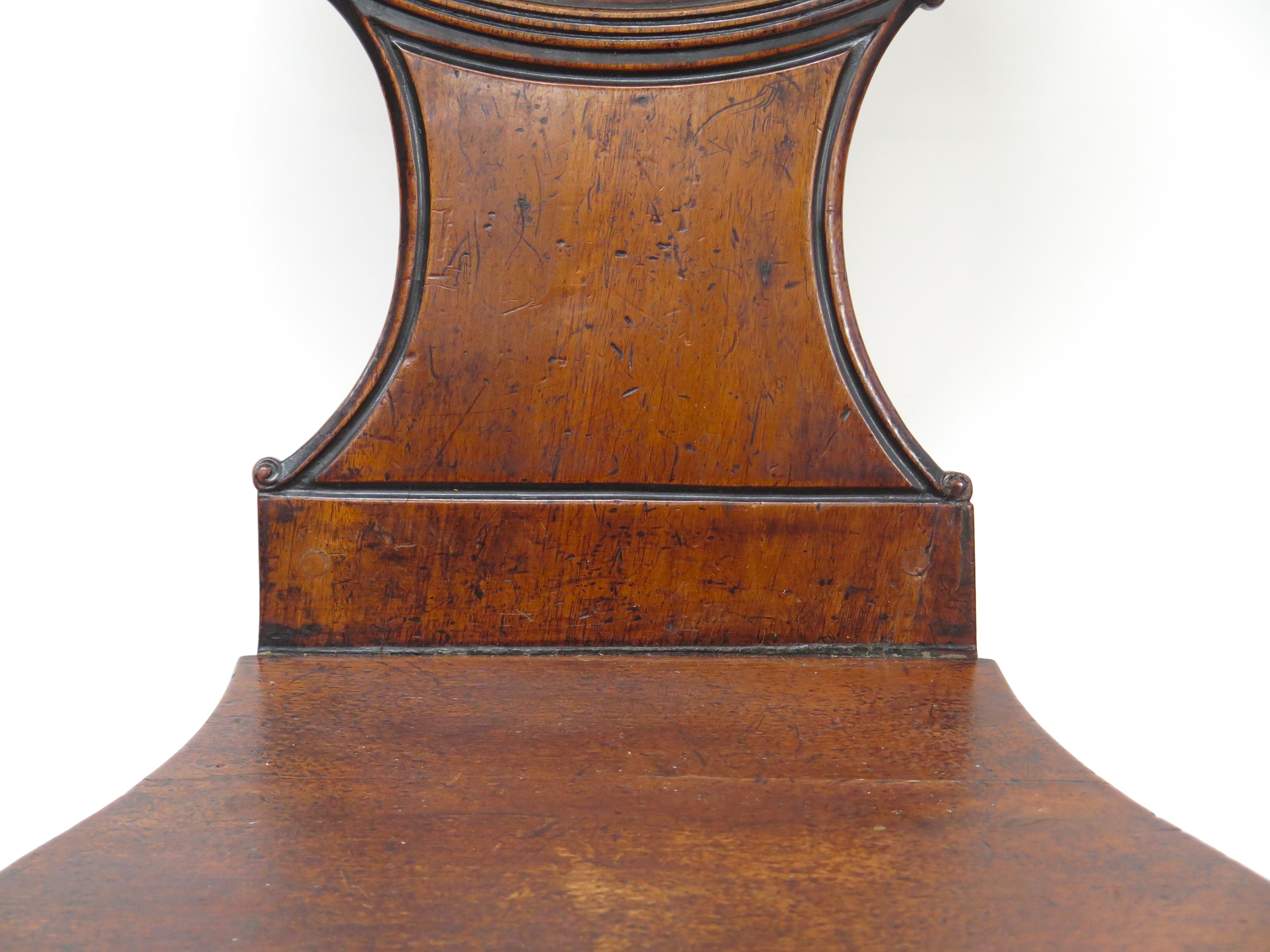 A Pair of English Regency Mahogany Hall Chairs