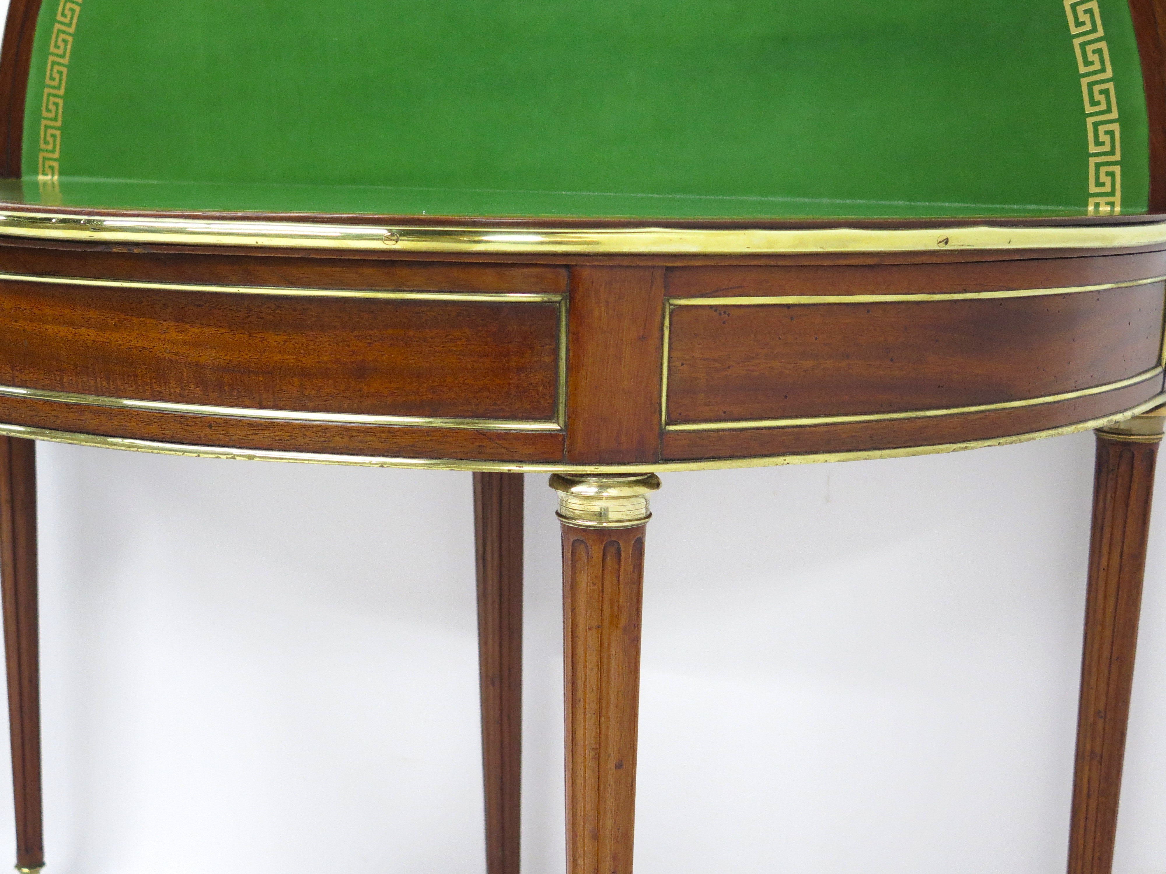 A Beatiful "Near" Pair of Louis XVI Style Mahogany and Brass Mounted Demilune Games Tables