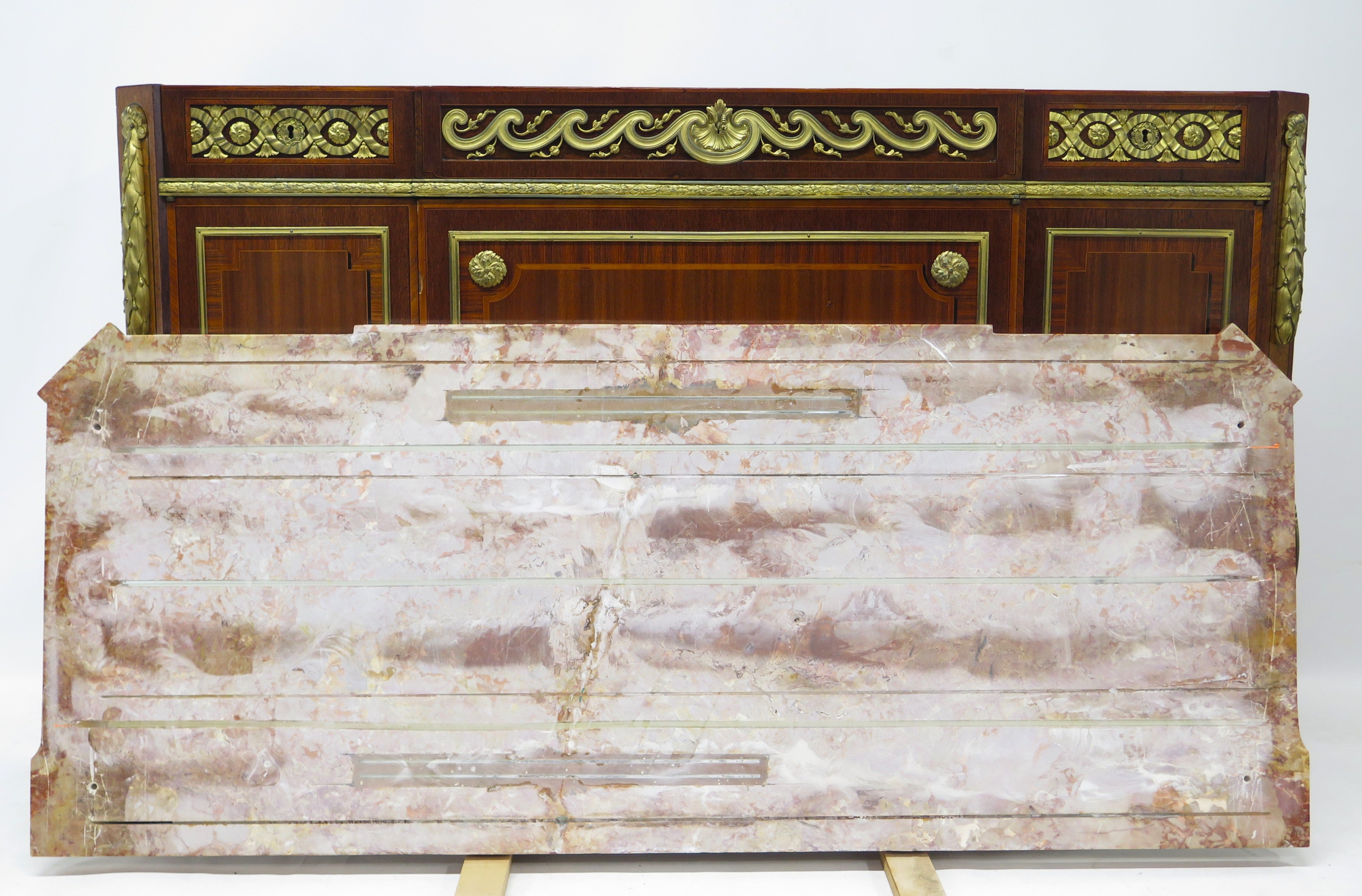 A French Ormolu-mounted Amaranth, Kingwood, Bois Satine, and Burr-amboyna Commode