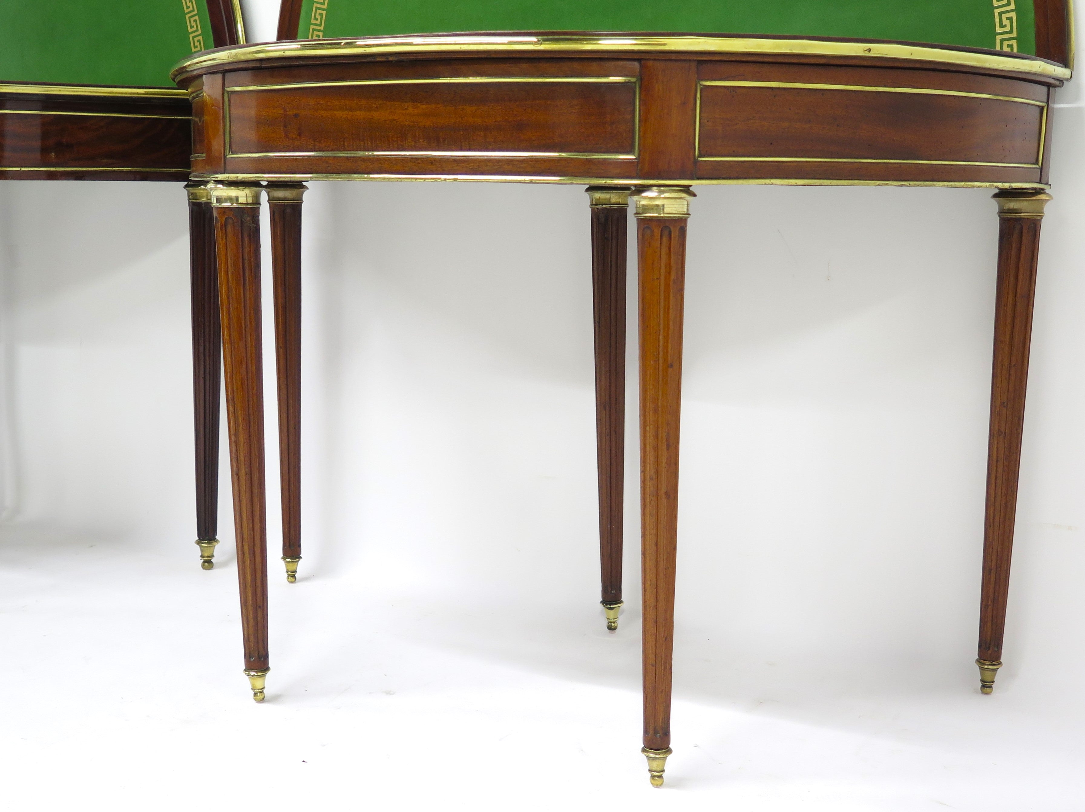A Beatiful "Near" Pair of Louis XVI Style Mahogany and Brass Mounted Demilune Games Tables