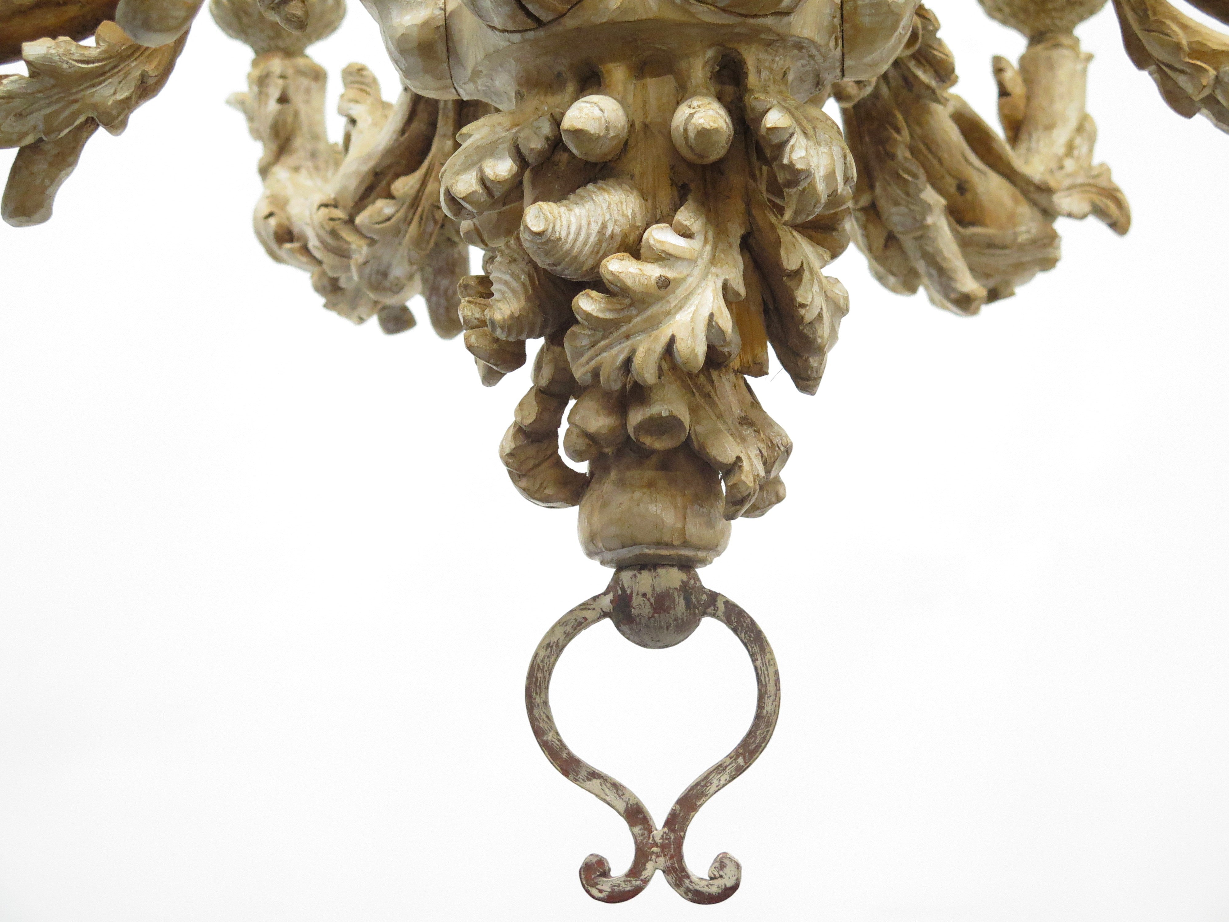 A Carved Italian Faux Bois Pickled Ten Light Chandelier