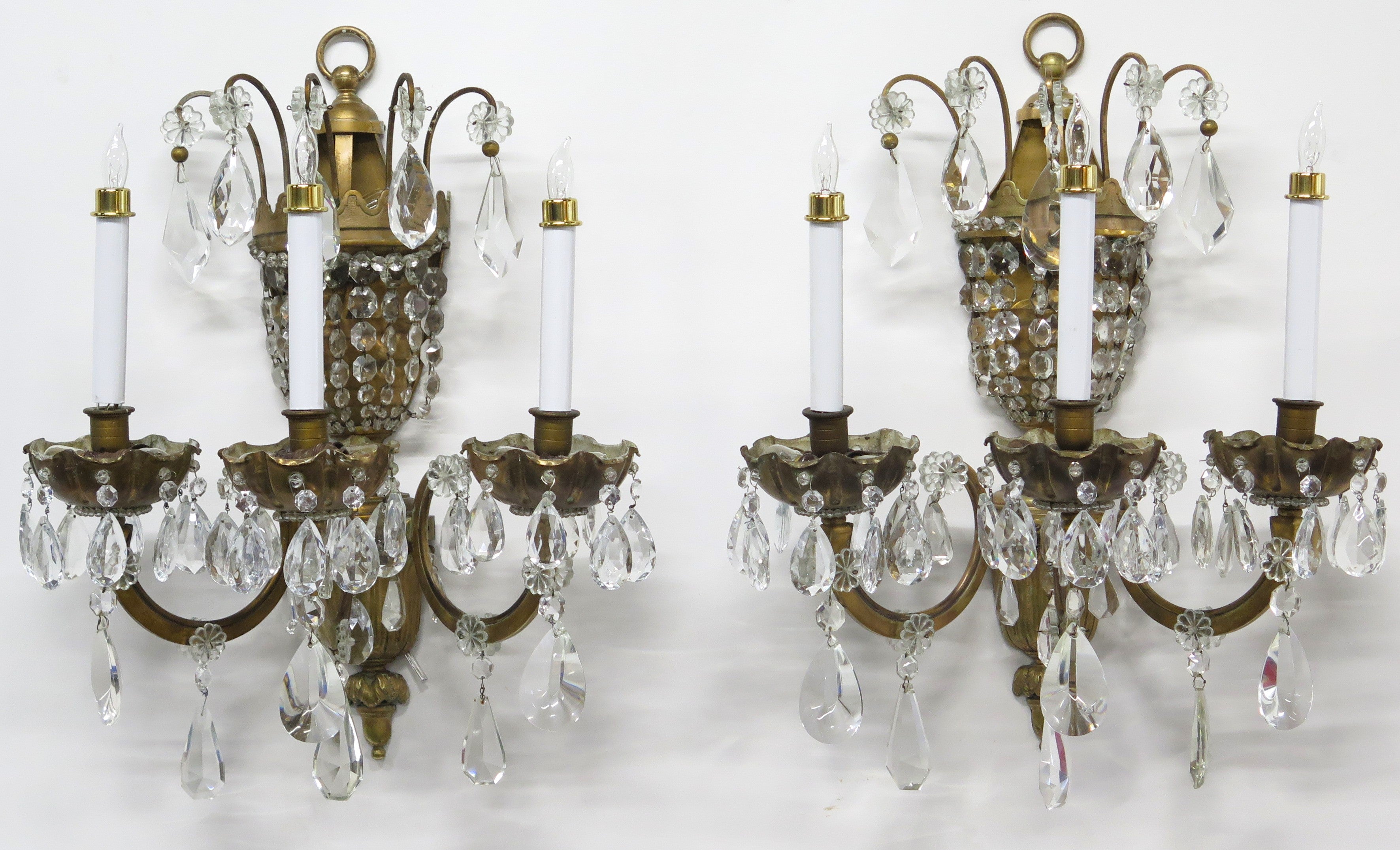 A Pair of Maison Jansen Three Light Bronze and Crystal Sconces