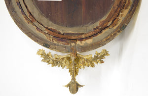 A Superb Early Regency Ebonised and Giltwood Convex Mirror