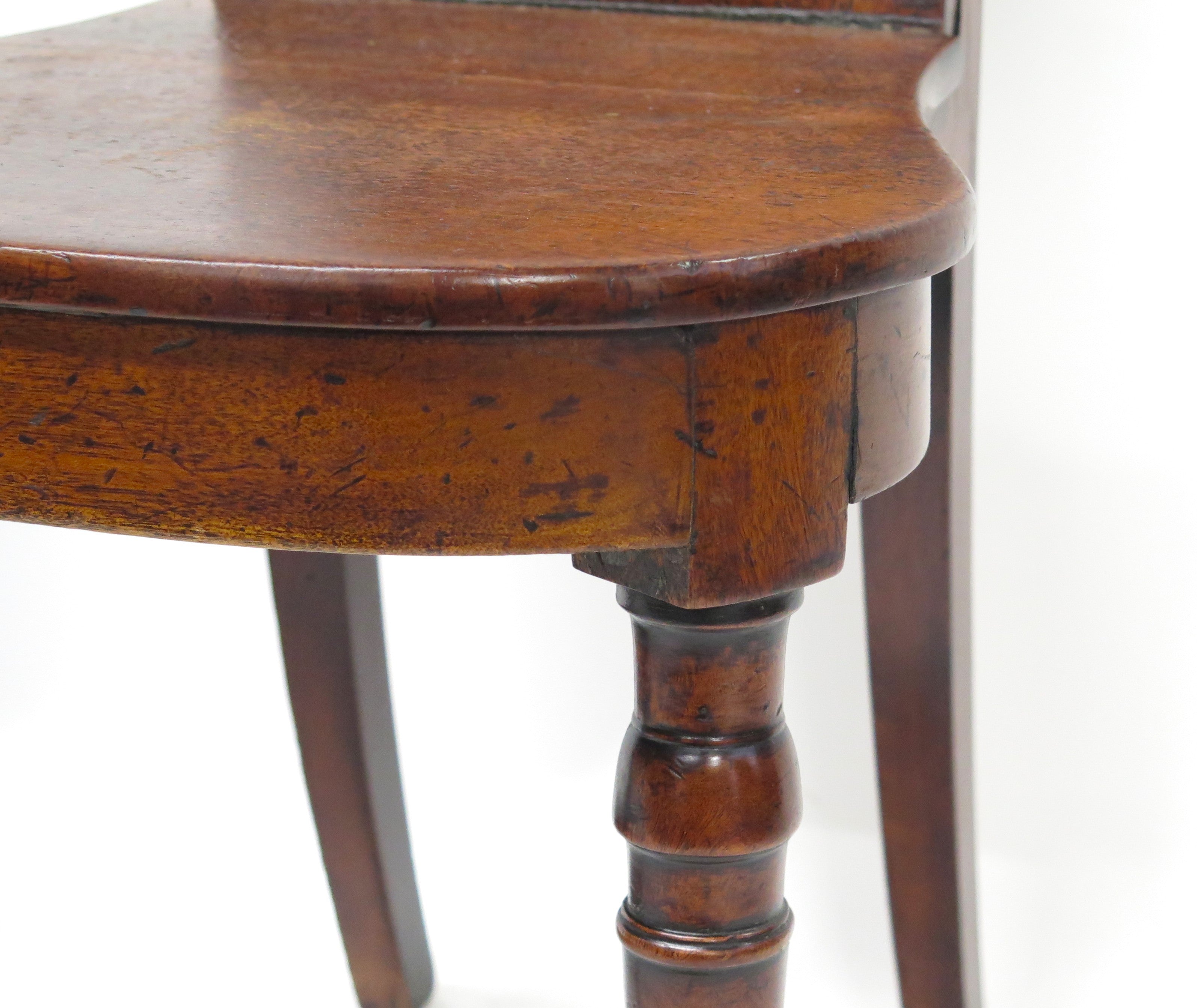 A Pair of English Regency Mahogany Hall Chairs