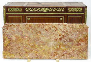 A French Ormolu-mounted Amaranth, Kingwood, Bois Satine, and Burr-amboyna Commode