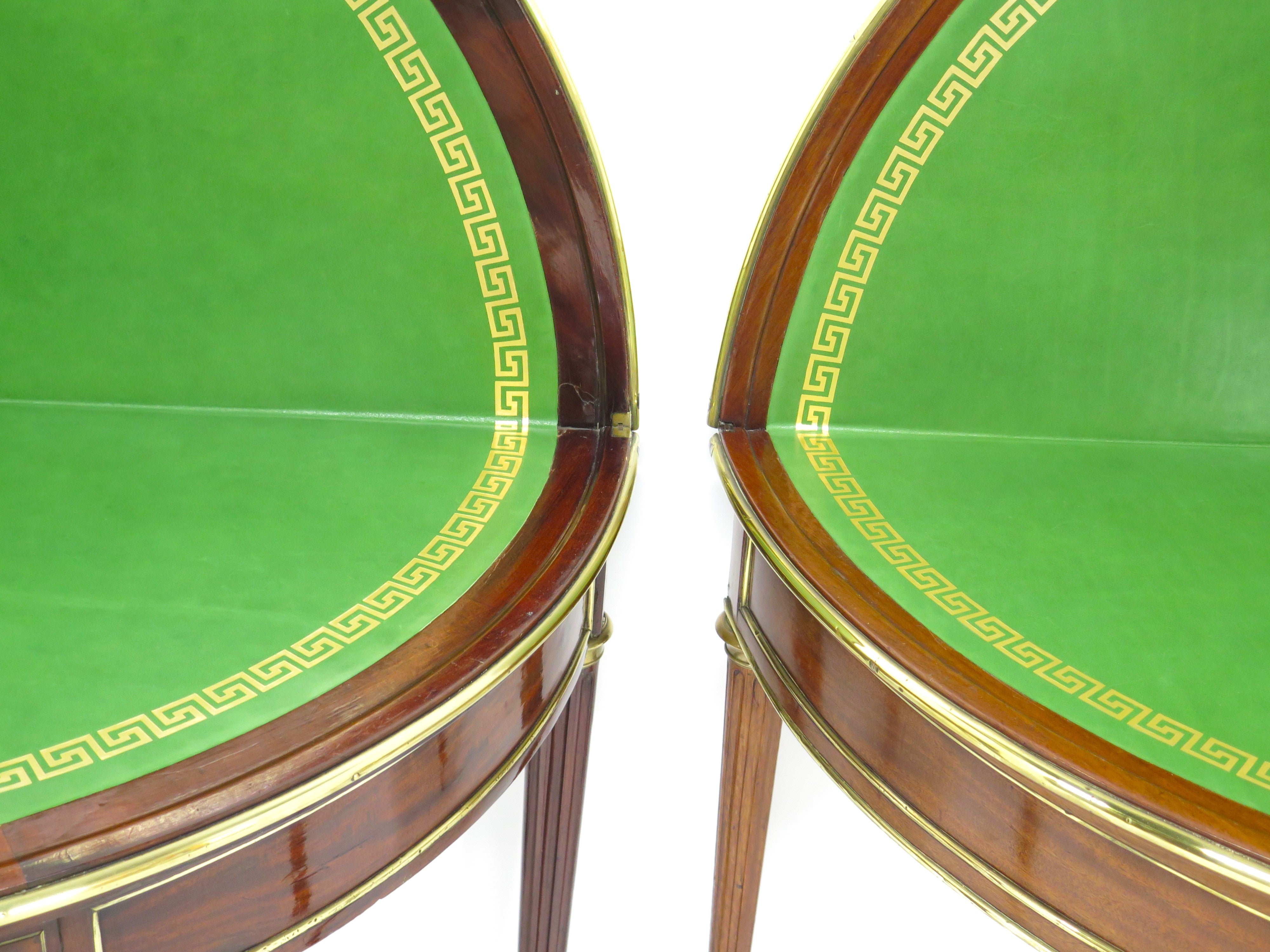 A Beatiful "Near" Pair of Louis XVI Style Mahogany and Brass Mounted Demilune Games Tables