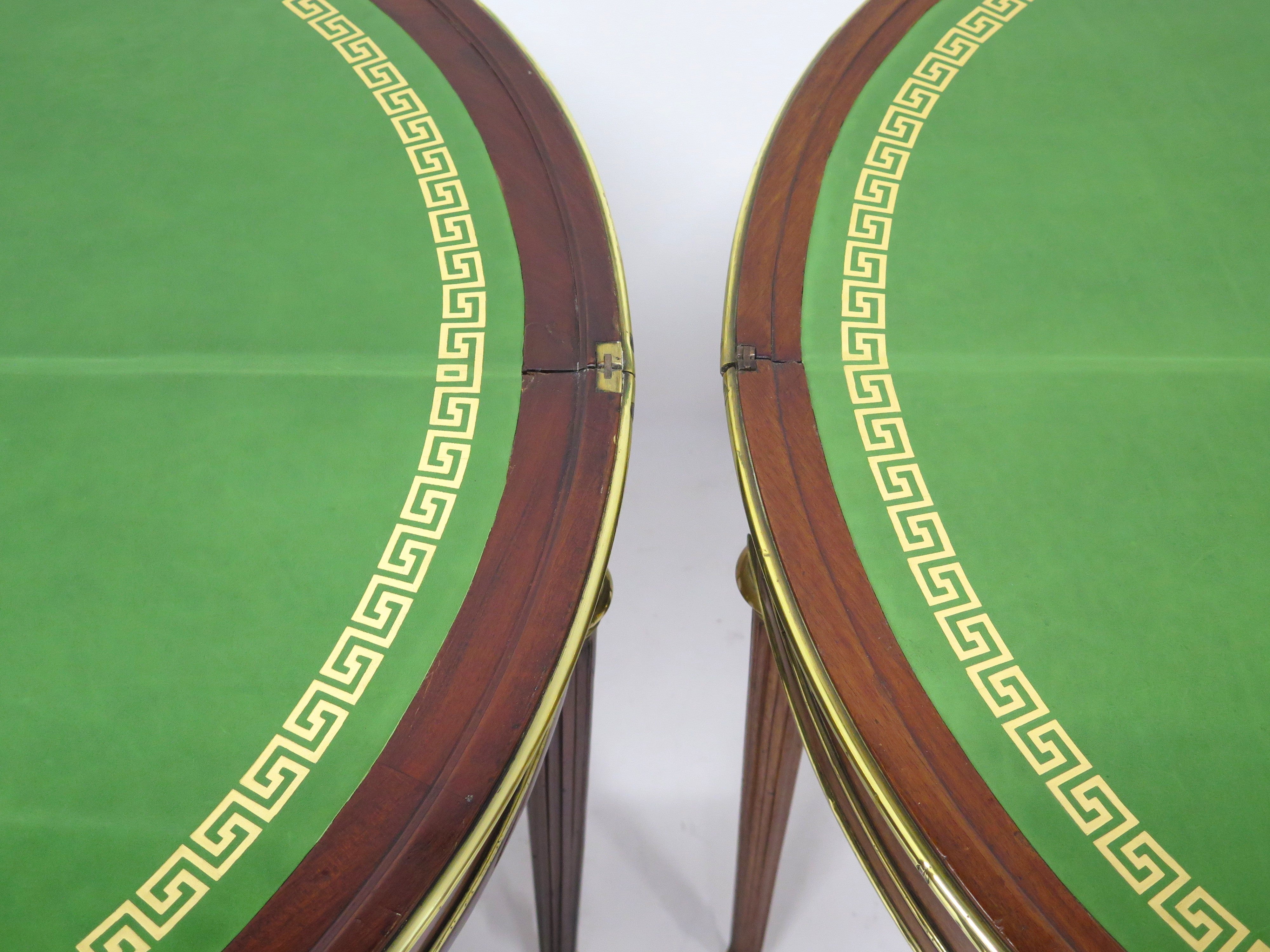 A Beatiful "Near" Pair of Louis XVI Style Mahogany and Brass Mounted Demilune Games Tables