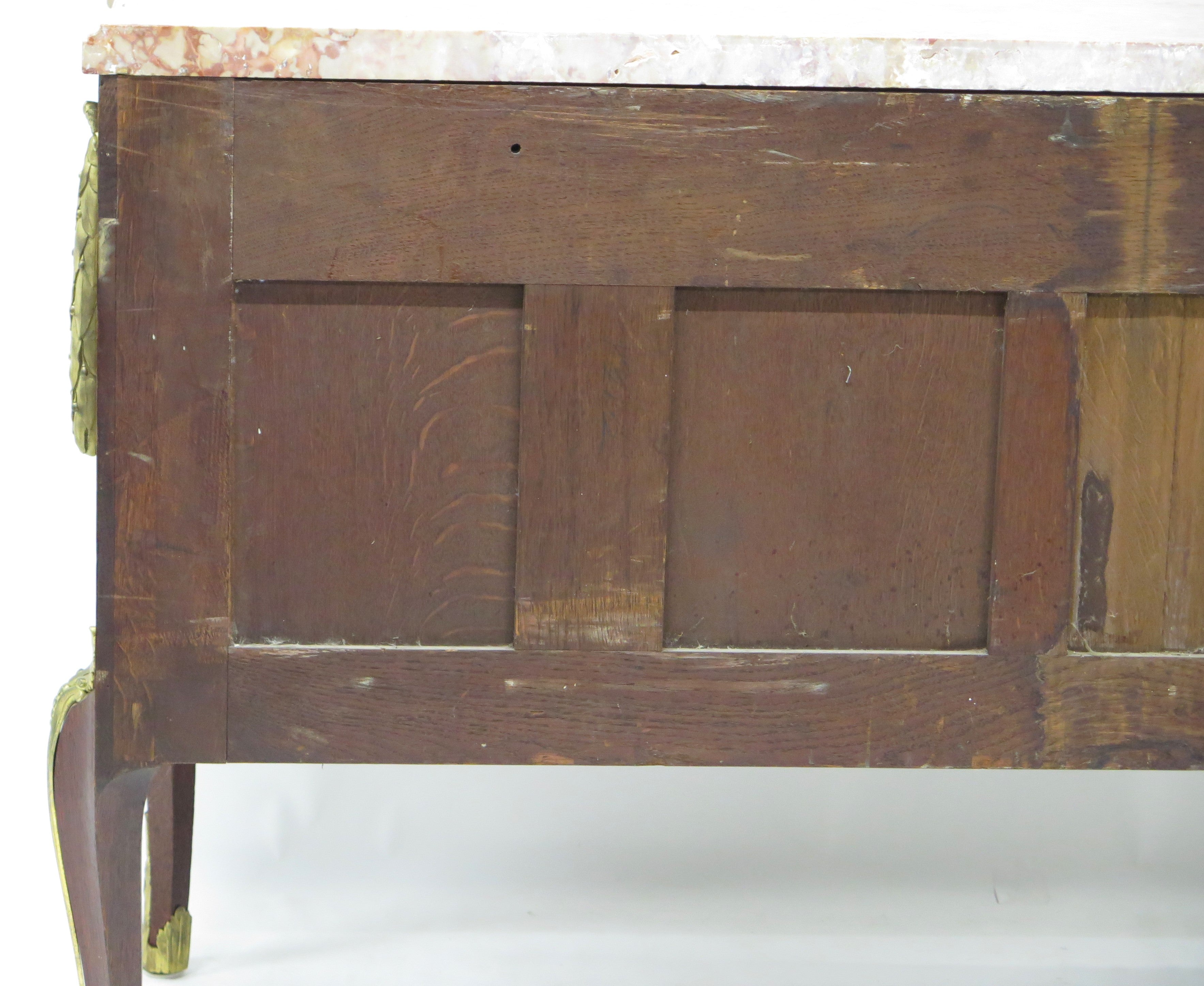A French Ormolu-mounted Amaranth, Kingwood, Bois Satine, and Burr-amboyna Commode