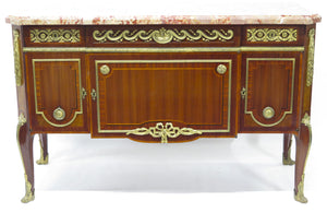A French Ormolu-mounted Amaranth, Kingwood, Bois Satine, and Burr-amboyna Commode