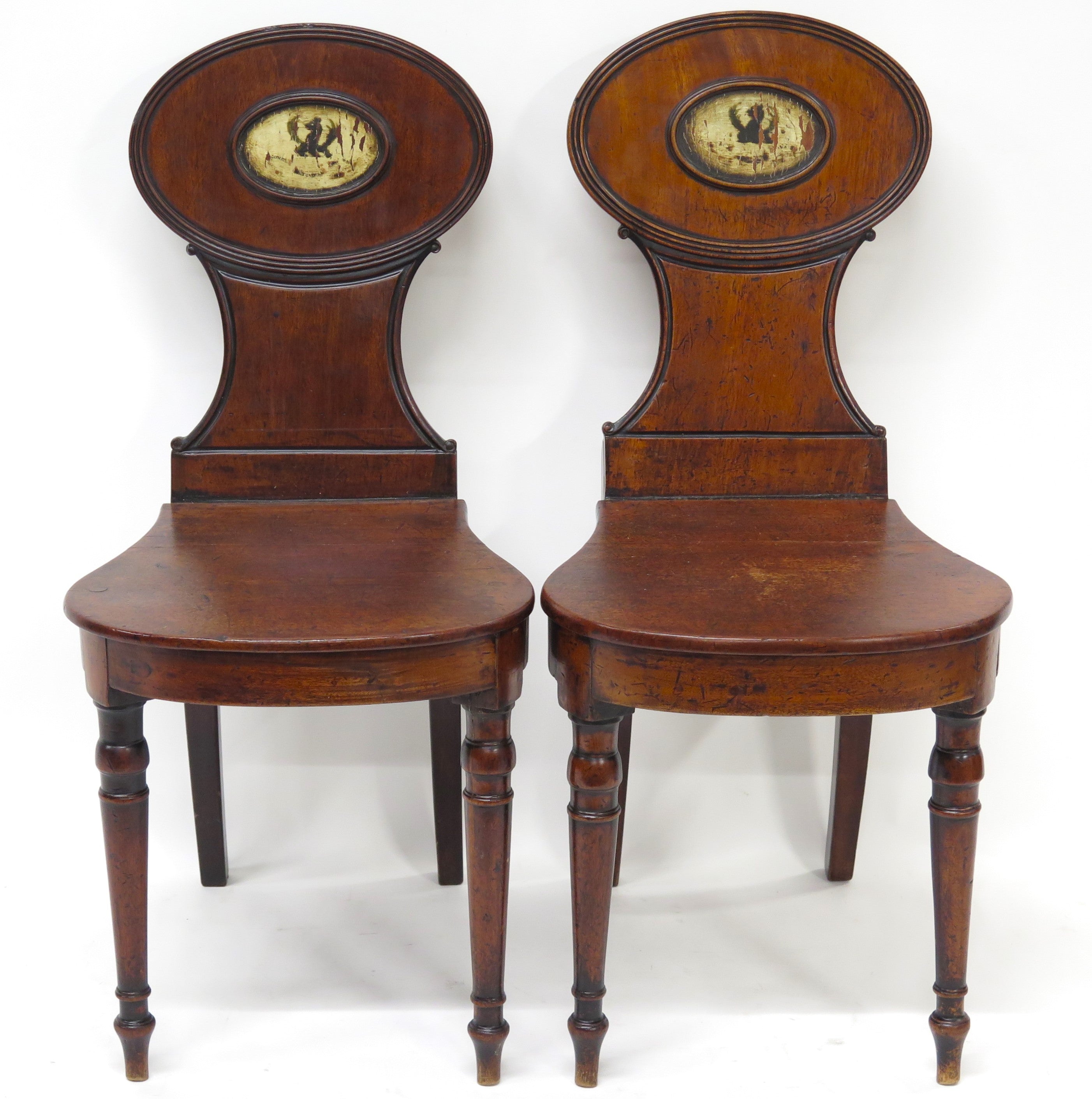 A Pair of English Regency Mahogany Hall Chairs