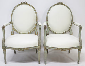 A Pair of 18th Century Paint and Parcel Gilt Italian Arm Chairs