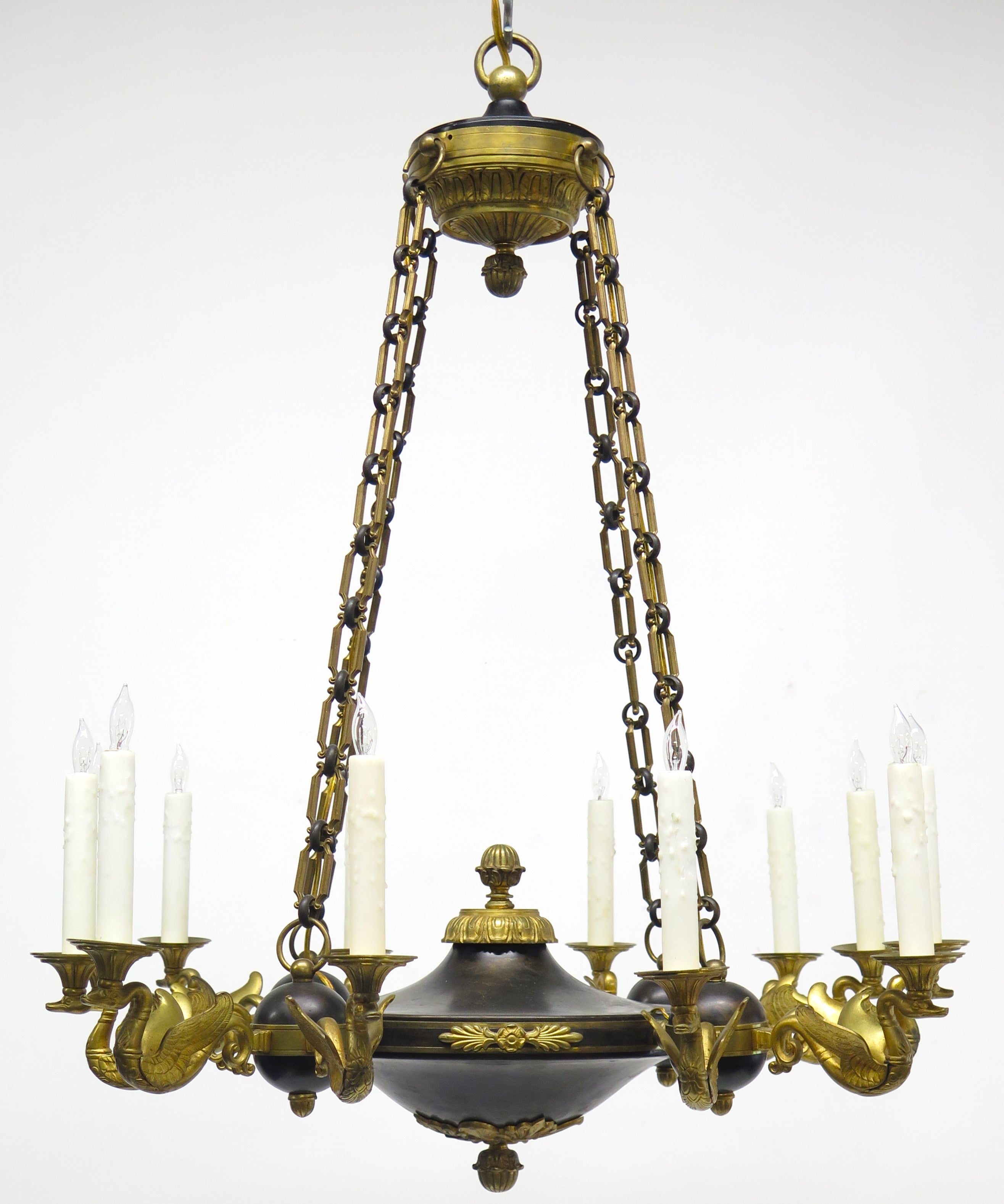 A Charles X Patinated and Gilt Metal Twelve Light Chandelier