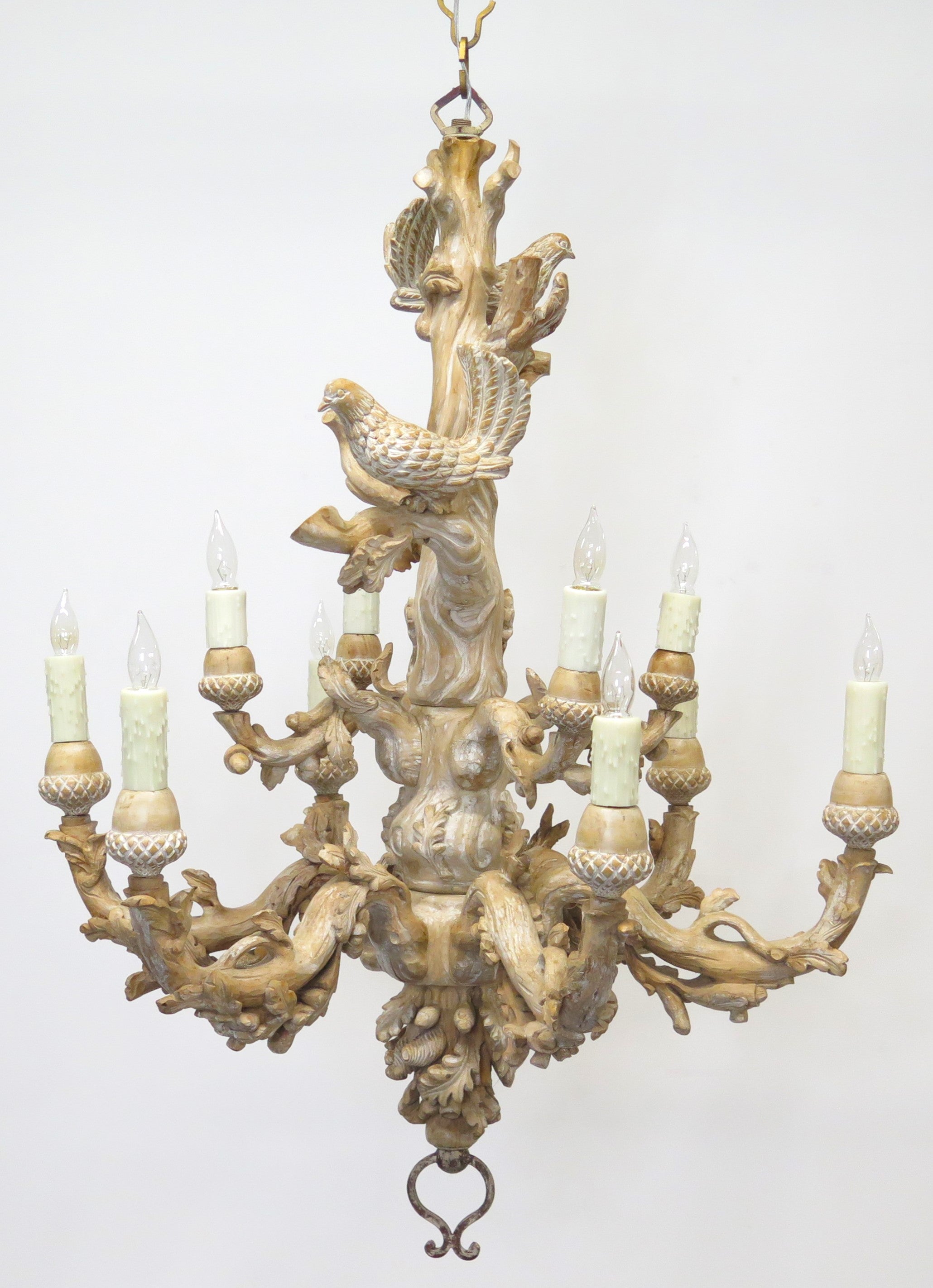 A Carved Italian Faux Bois Pickled Ten Light Chandelier