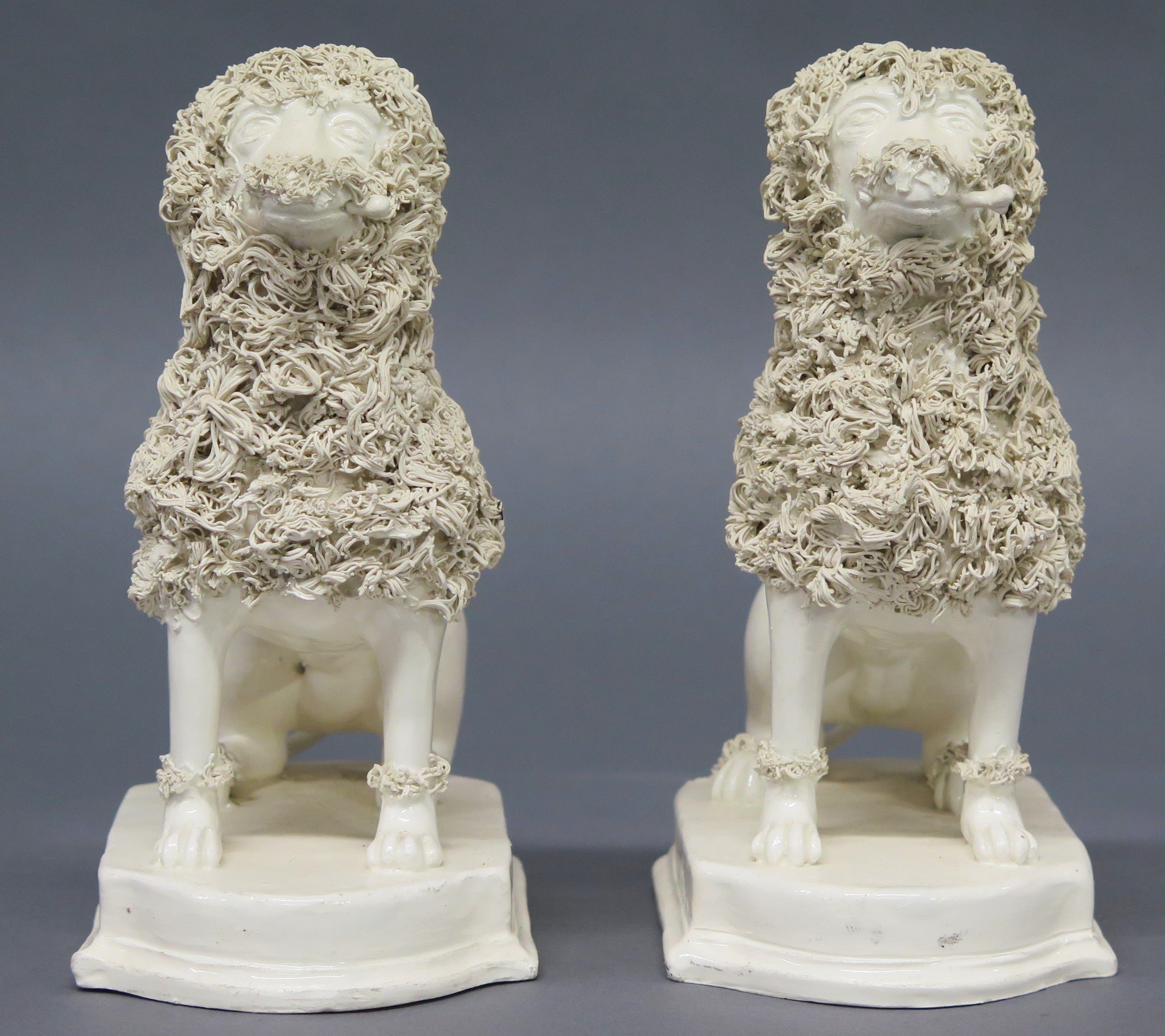 A Pair of Early 19th Century Creamware Dogs