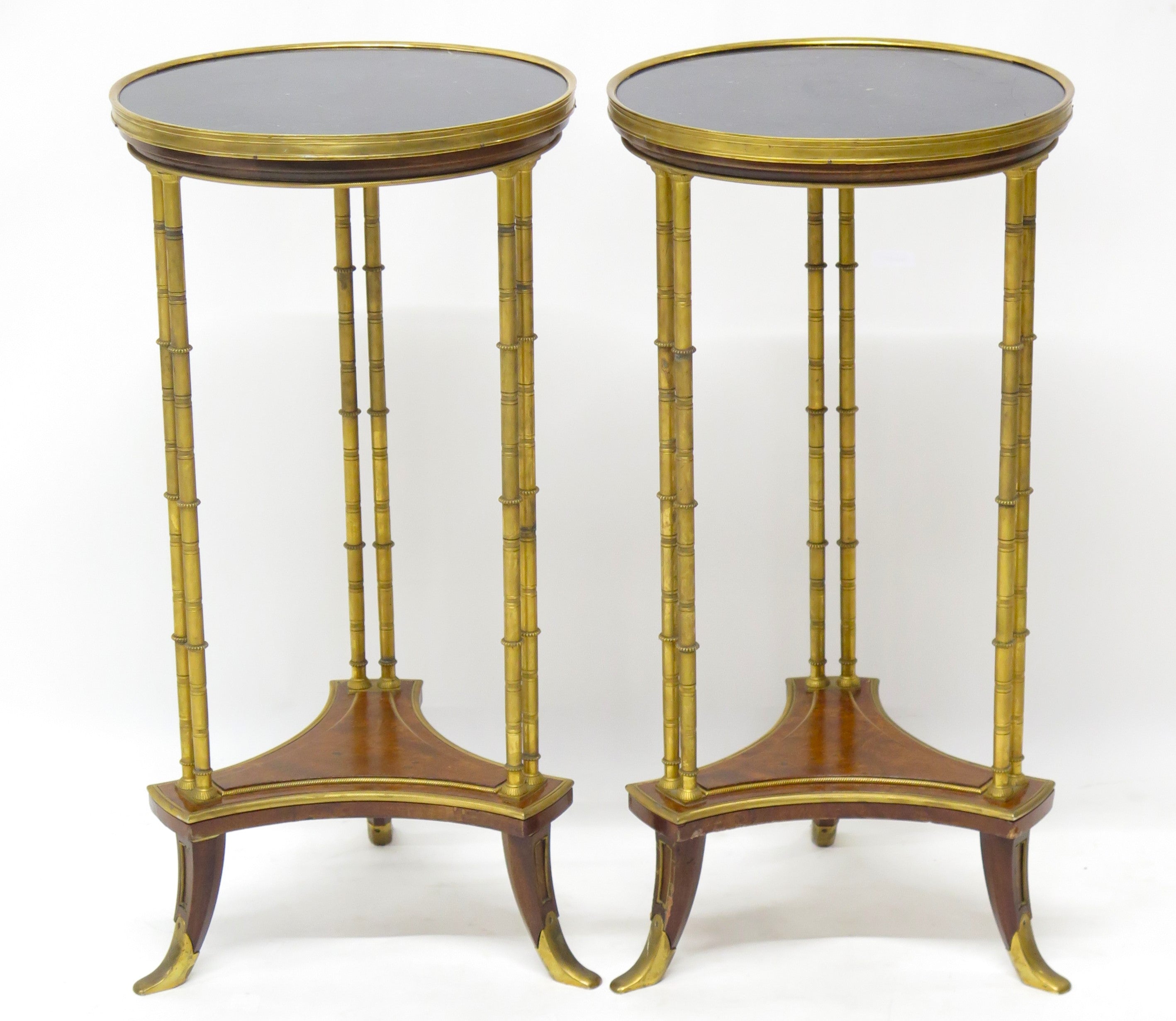 A pair of elegant Louis XVI-style gilt bronze gueridons