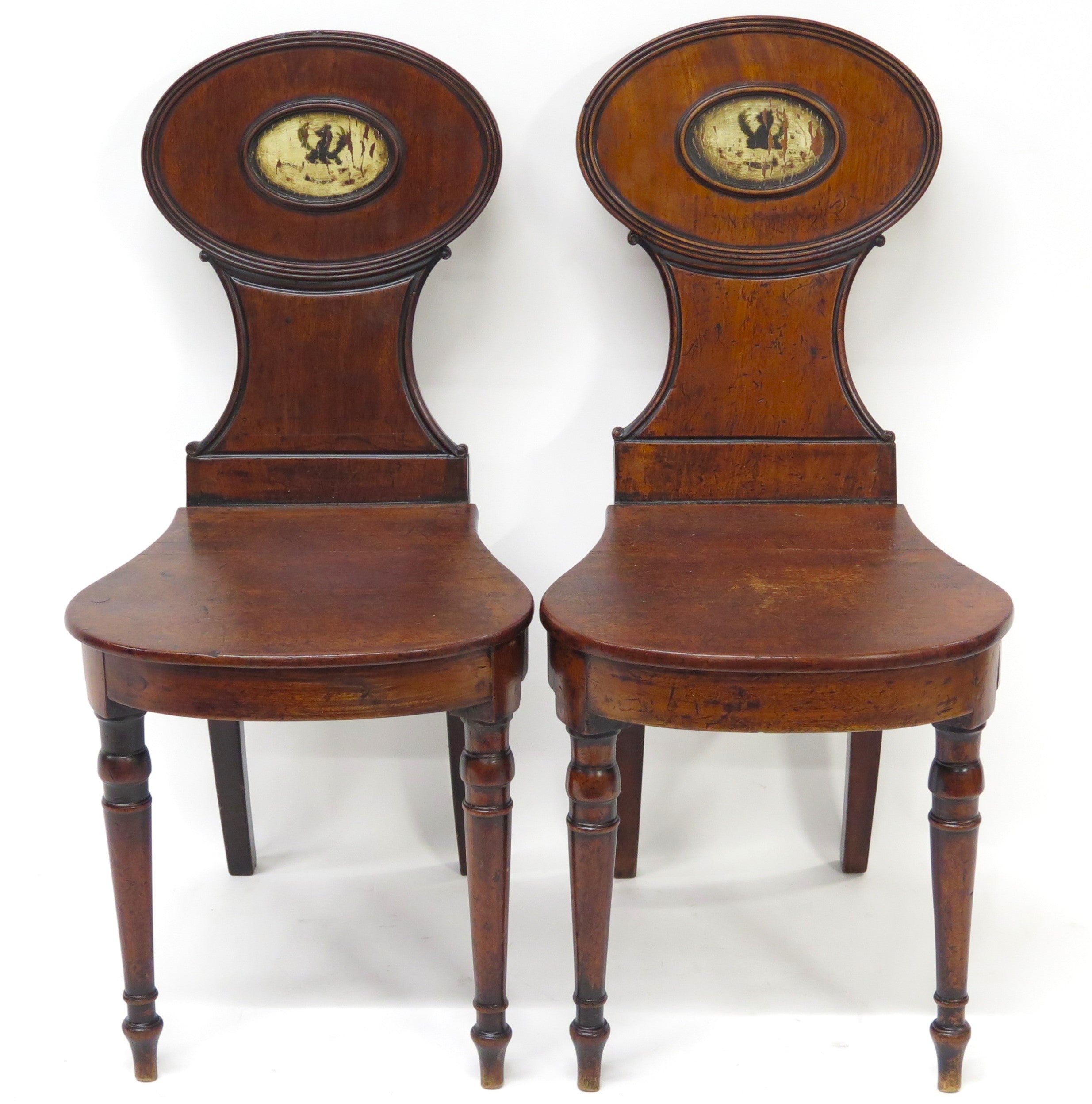 A Pair of English Regency Mahogany Hall Chairs
