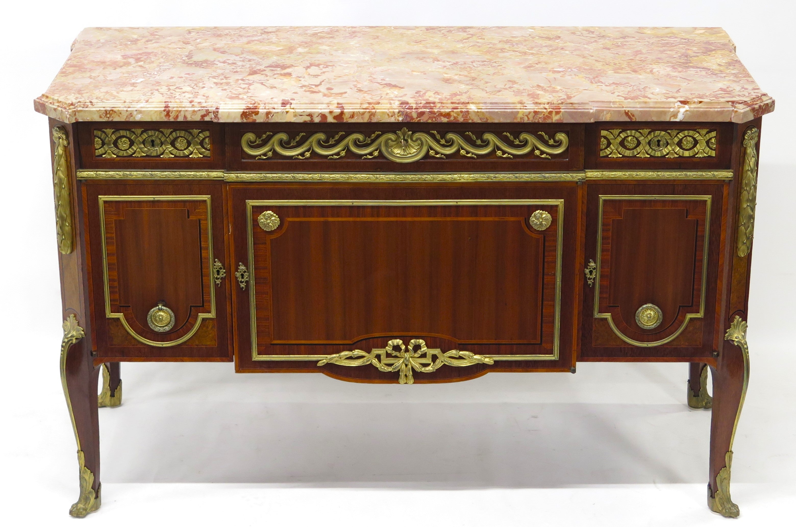 A French Ormolu-mounted Amaranth, Kingwood, Bois Satine, and Burr-amboyna Commode