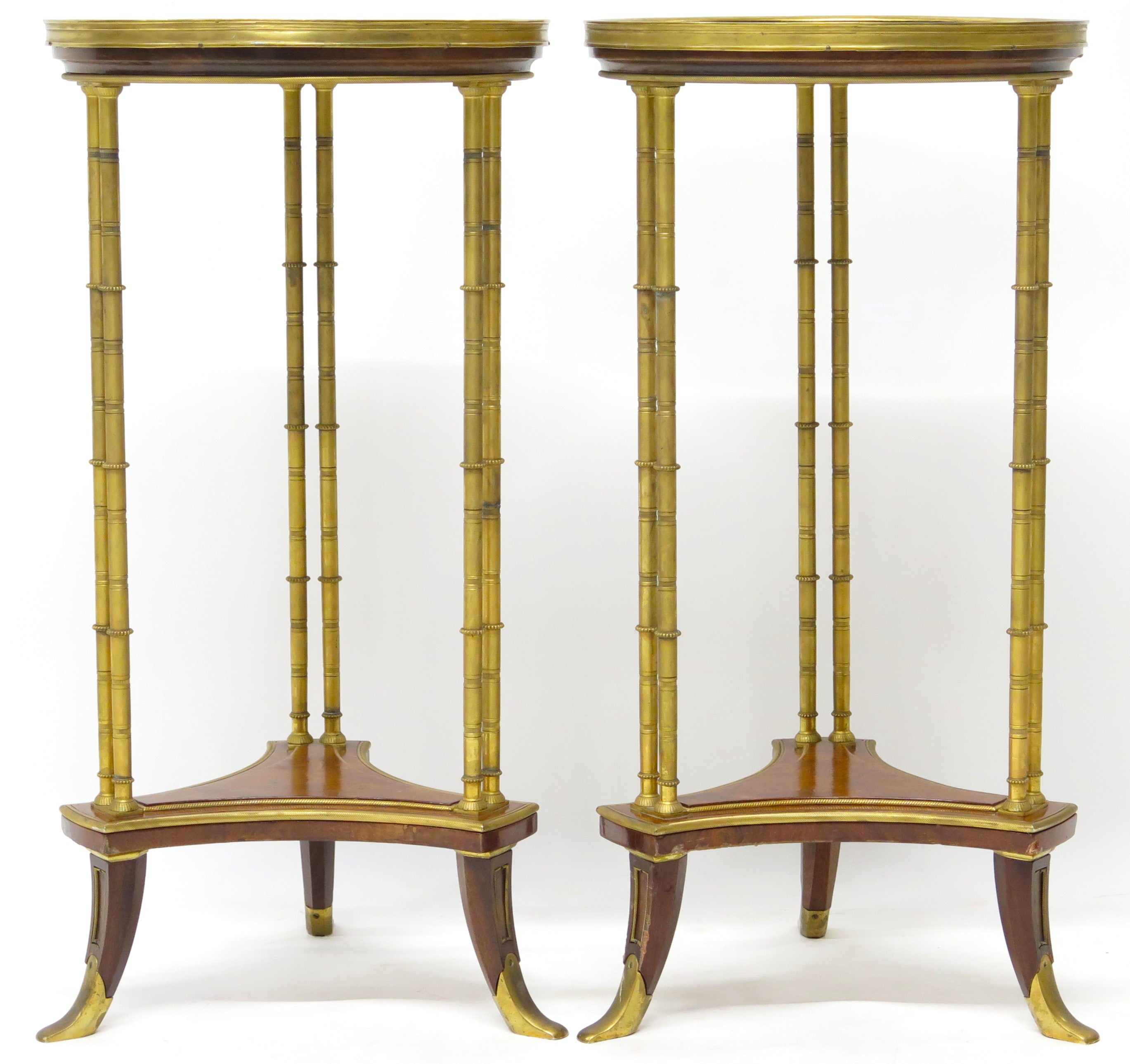 A pair of elegant Louis XVI-style gilt bronze gueridons