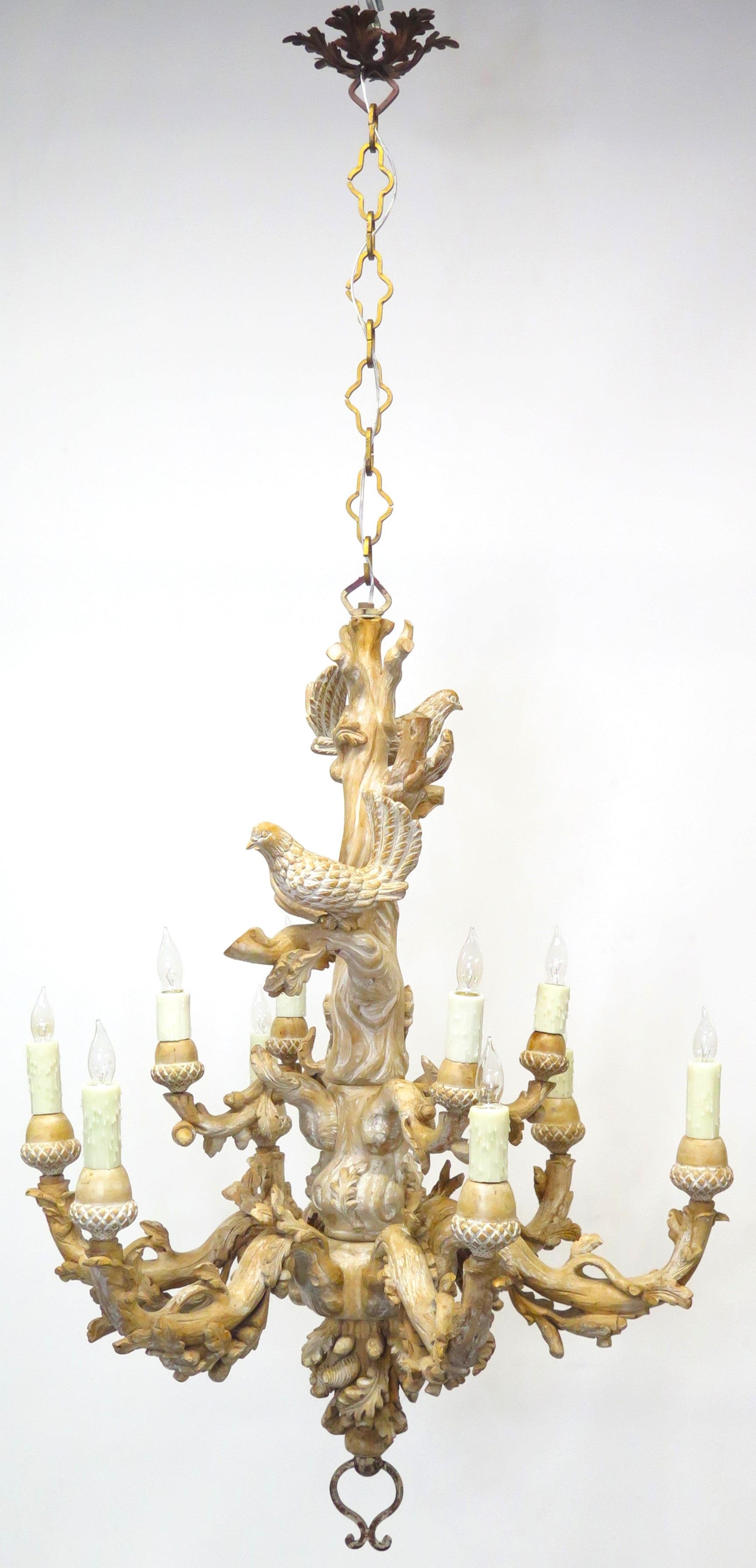 A Carved Italian Faux Bois Pickled Ten Light Chandelier