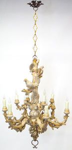 A Carved Italian Faux Bois Pickled Ten Light Chandelier