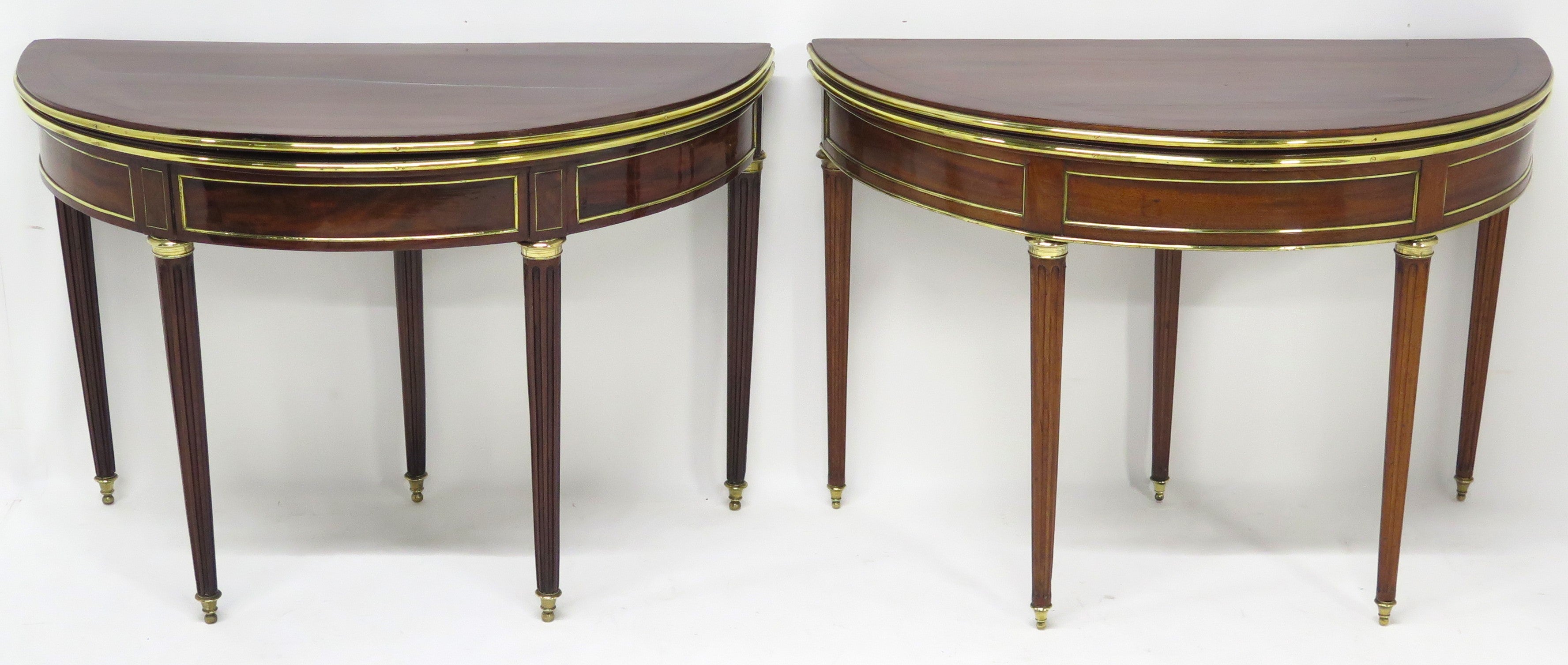 A Beatiful "Near" Pair of Louis XVI Style Mahogany and Brass Mounted Demilune Games Tables