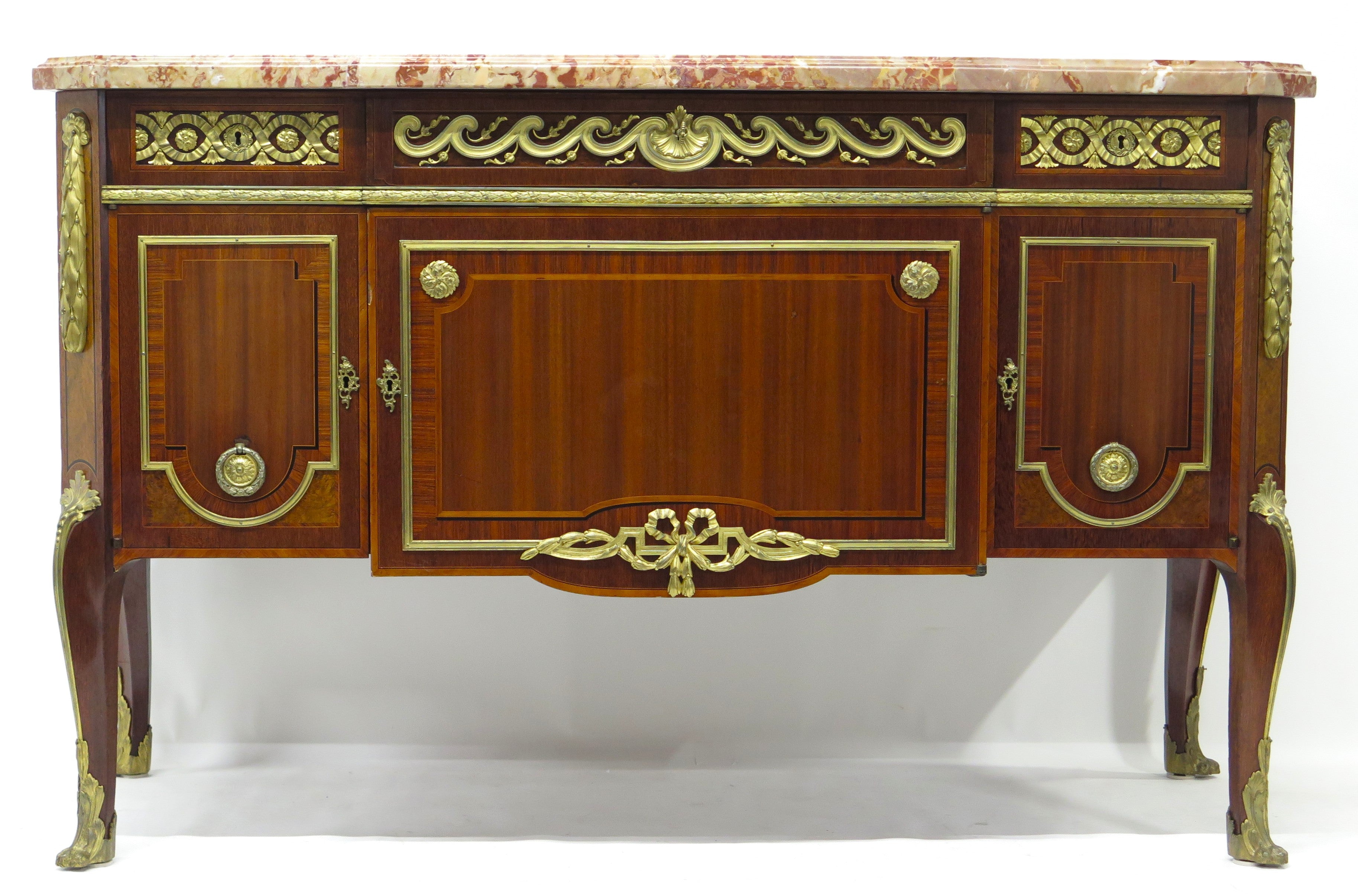 A French Ormolu-mounted Amaranth, Kingwood, Bois Satine, and Burr-amboyna Commode