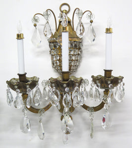 A Pair of Maison Jansen Three Light Bronze and Crystal Sconces