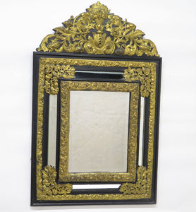 Dutch Looking Glass of Ebony and Brass Repoussé