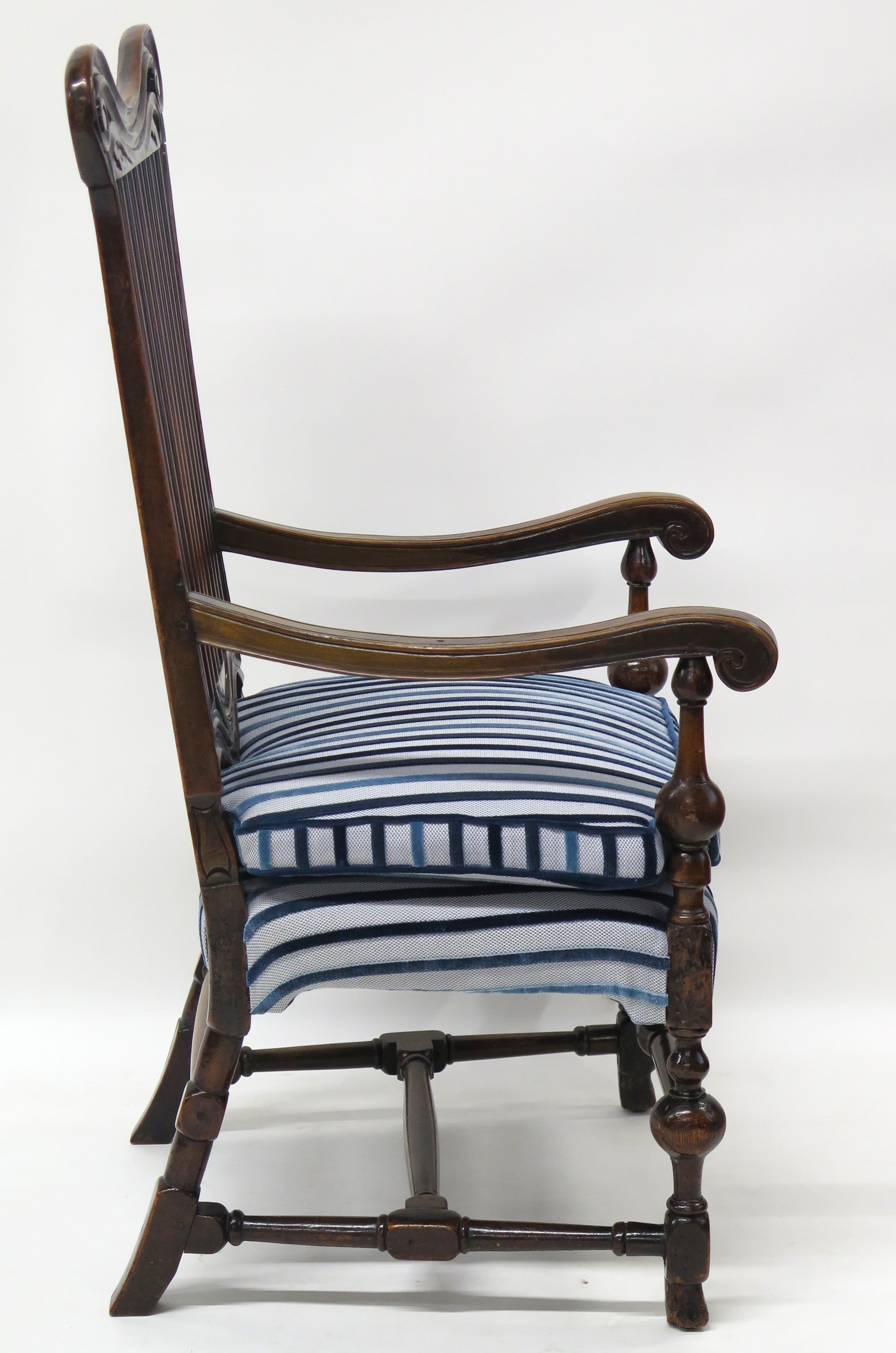 A Rare Form William and Mary Walnut Banister Back Armchair