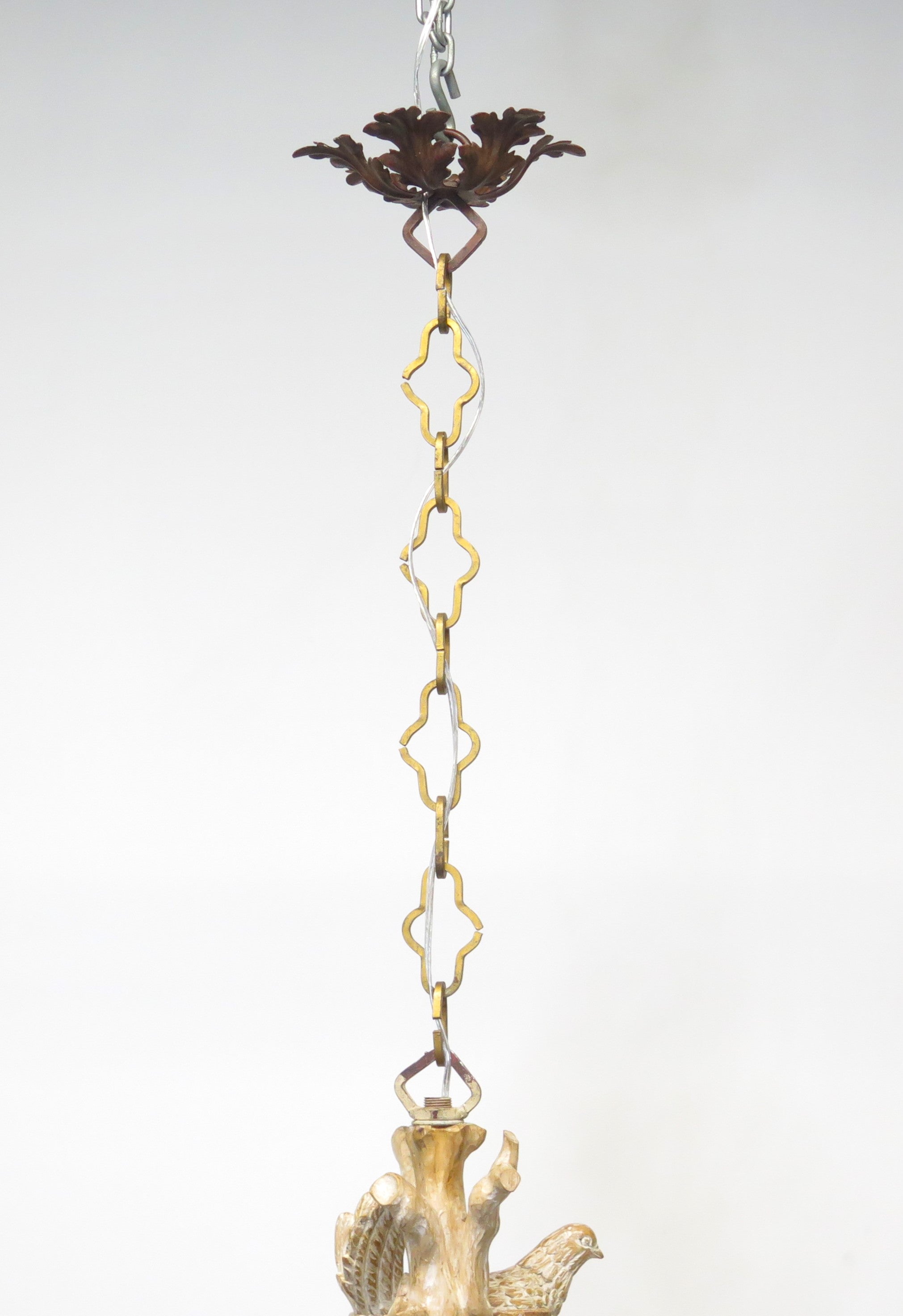 A Carved Italian Faux Bois Pickled Ten Light Chandelier