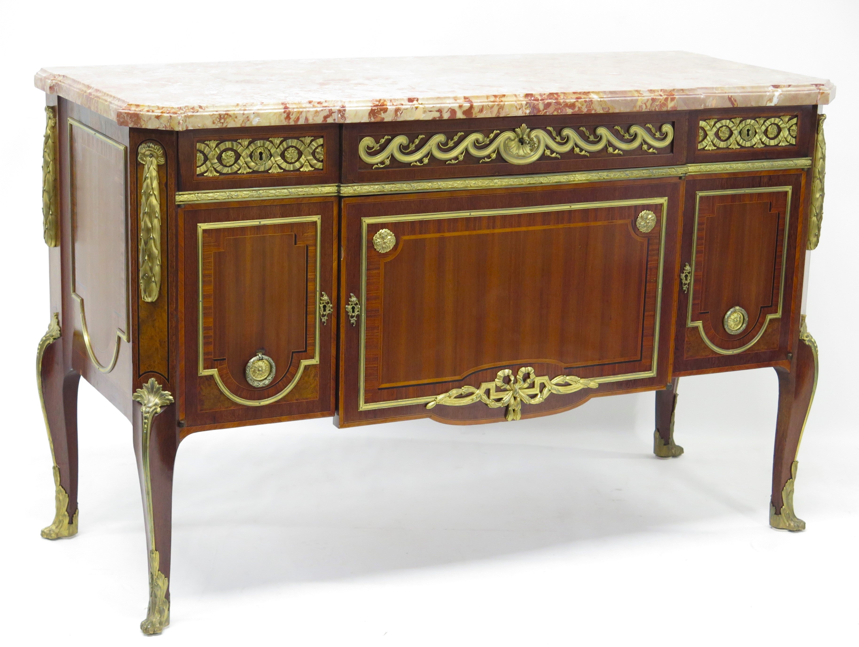 A French Ormolu-mounted Amaranth, Kingwood, Bois Satine, and Burr-amboyna Commode