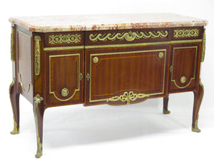 A French Ormolu-mounted Amaranth, Kingwood, Bois Satine, and Burr-amboyna Commode