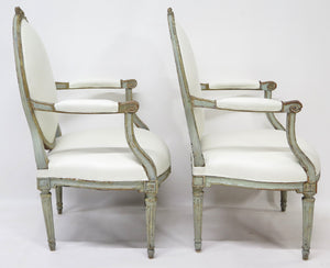A Pair of 18th Century Paint and Parcel Gilt Italian Arm Chairs