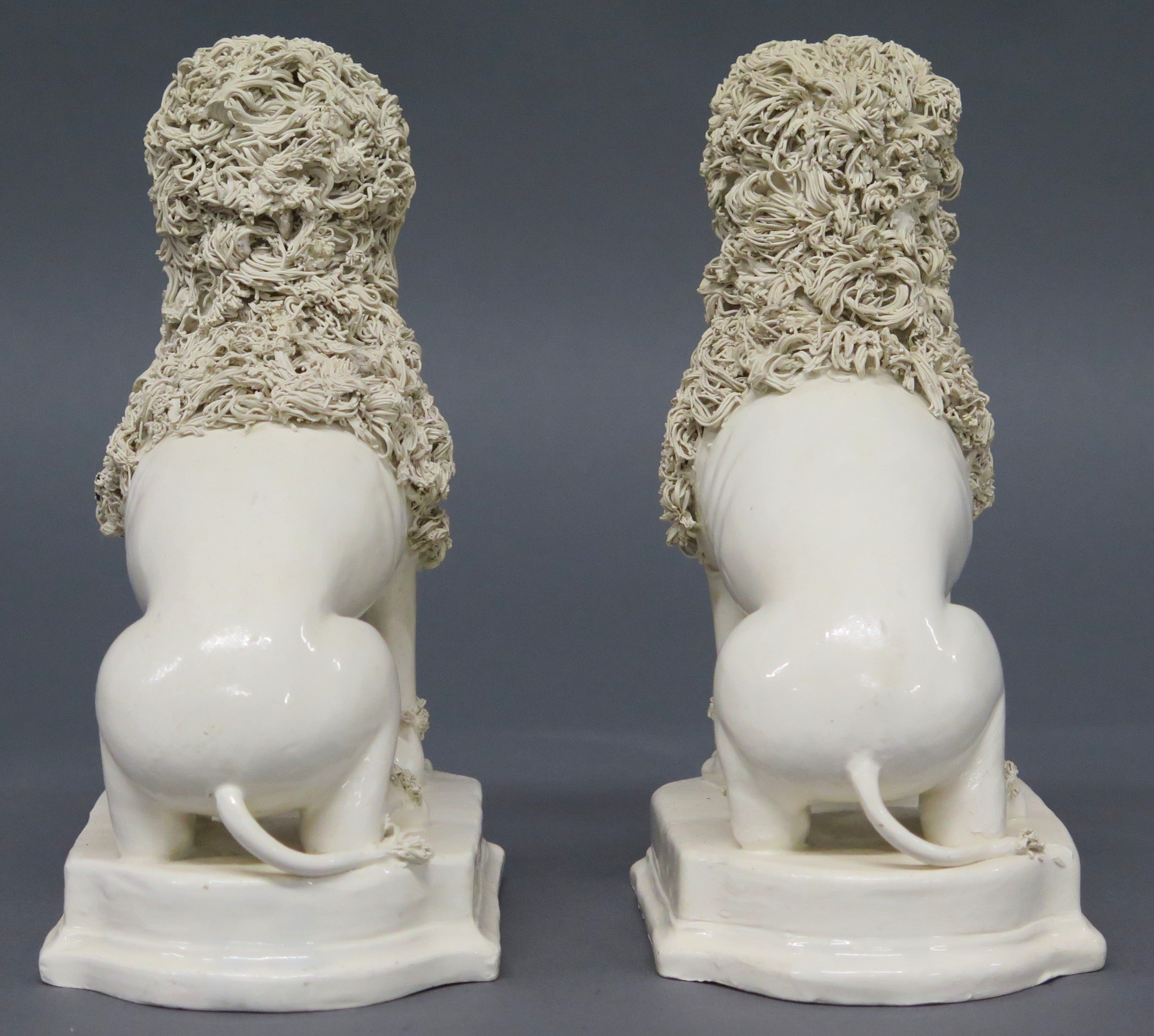 A Pair of Early 19th Century Creamware Dogs