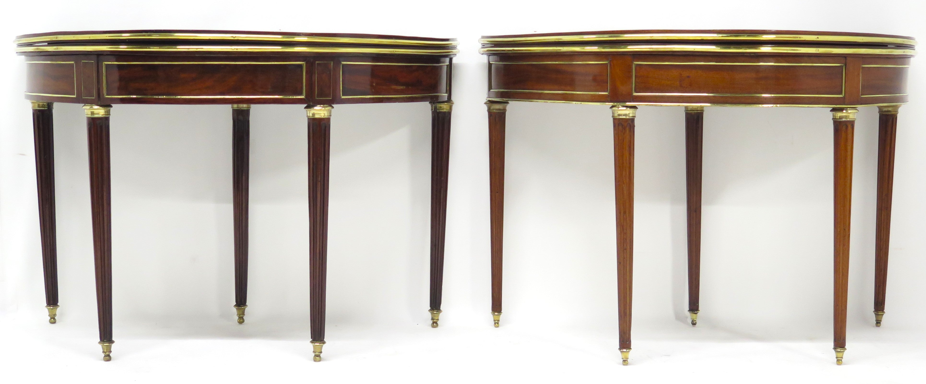 A Beatiful "Near" Pair of Louis XVI Style Mahogany and Brass Mounted Demilune Games Tables