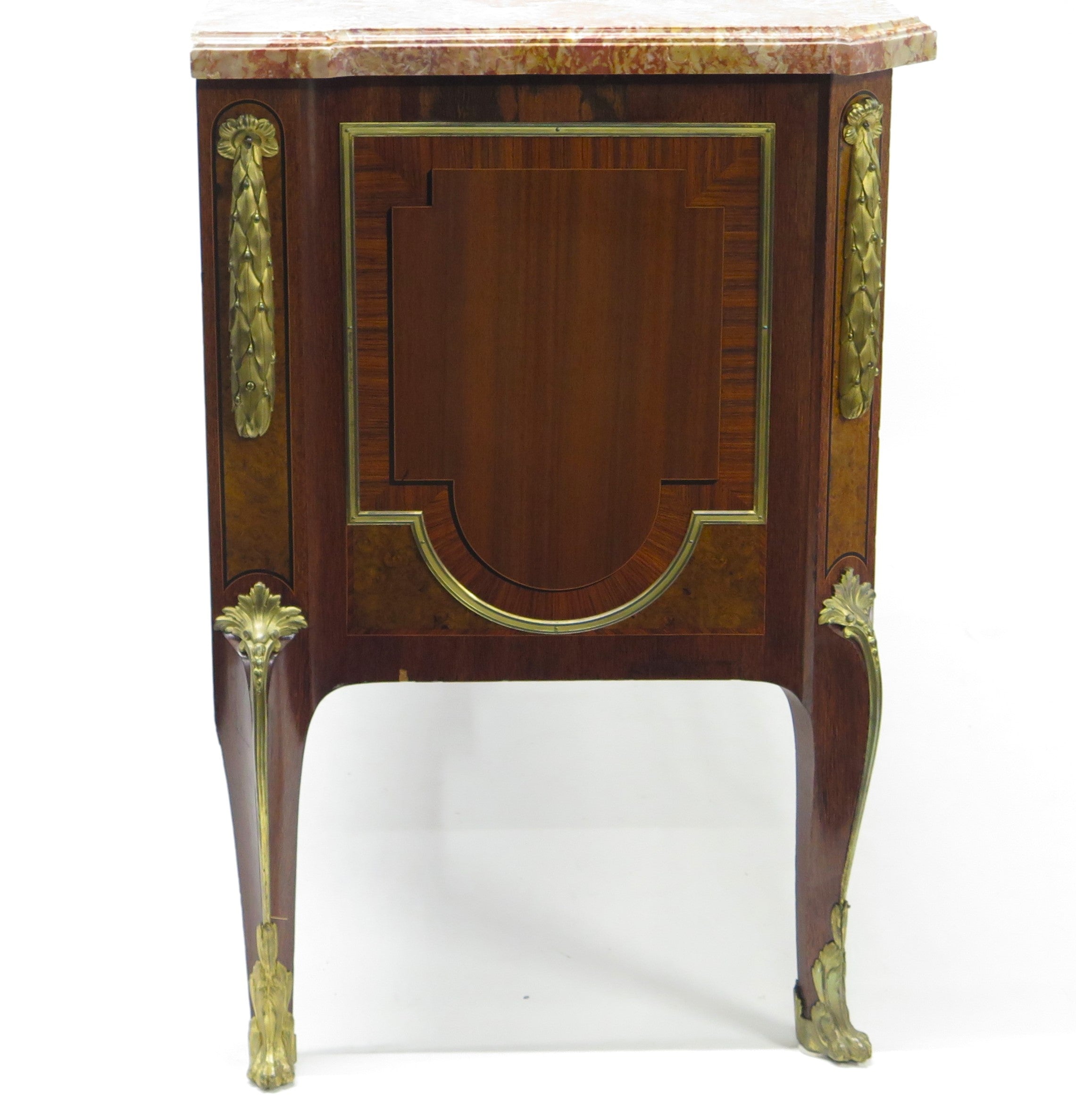 A French Ormolu-mounted Amaranth, Kingwood, Bois Satine, and Burr-amboyna Commode