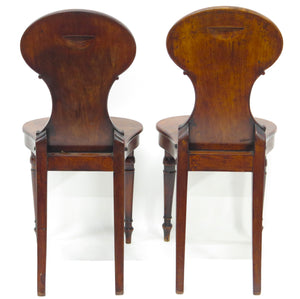 A Pair of English Regency Mahogany Hall Chairs