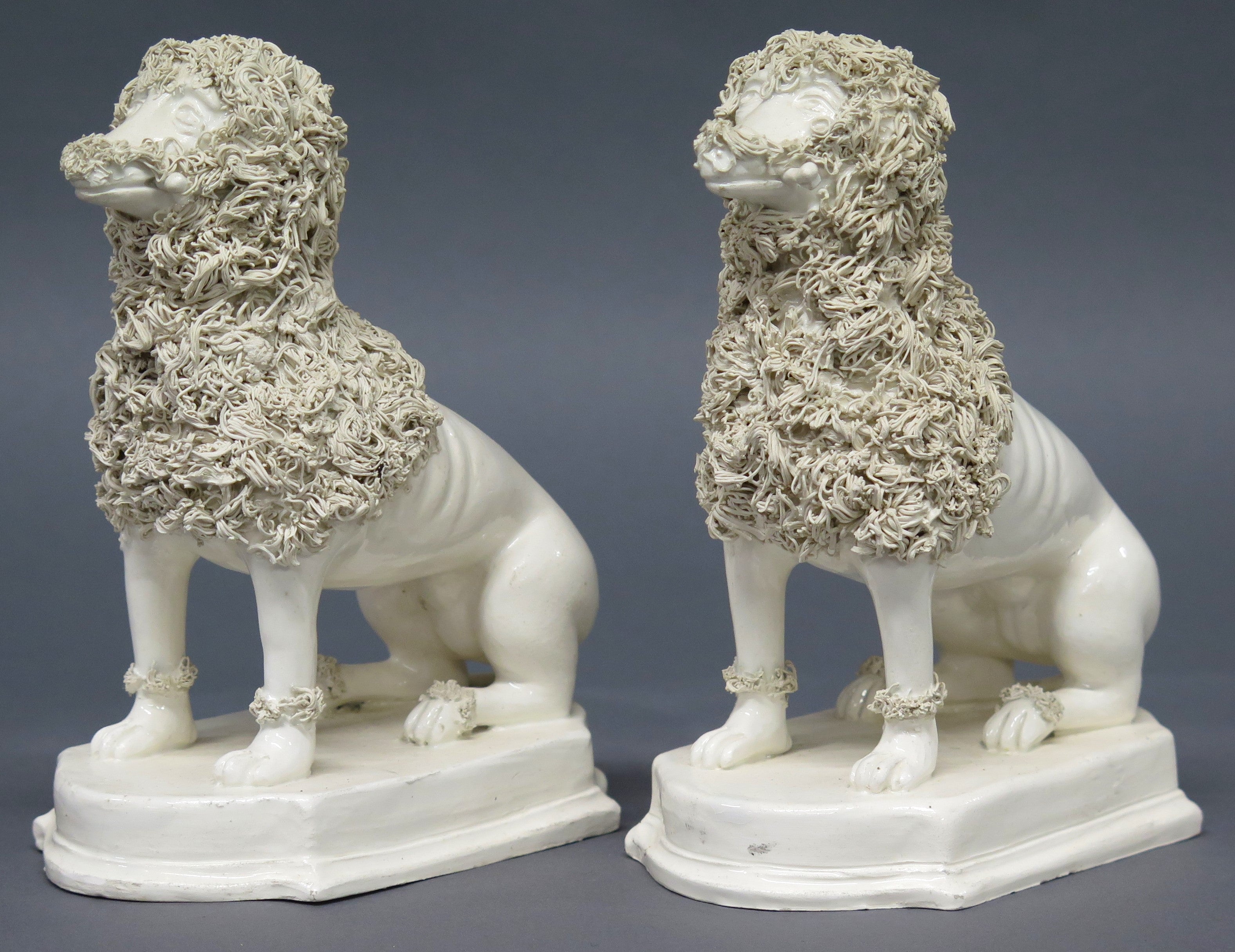 A Pair of Early 19th Century Creamware Dogs