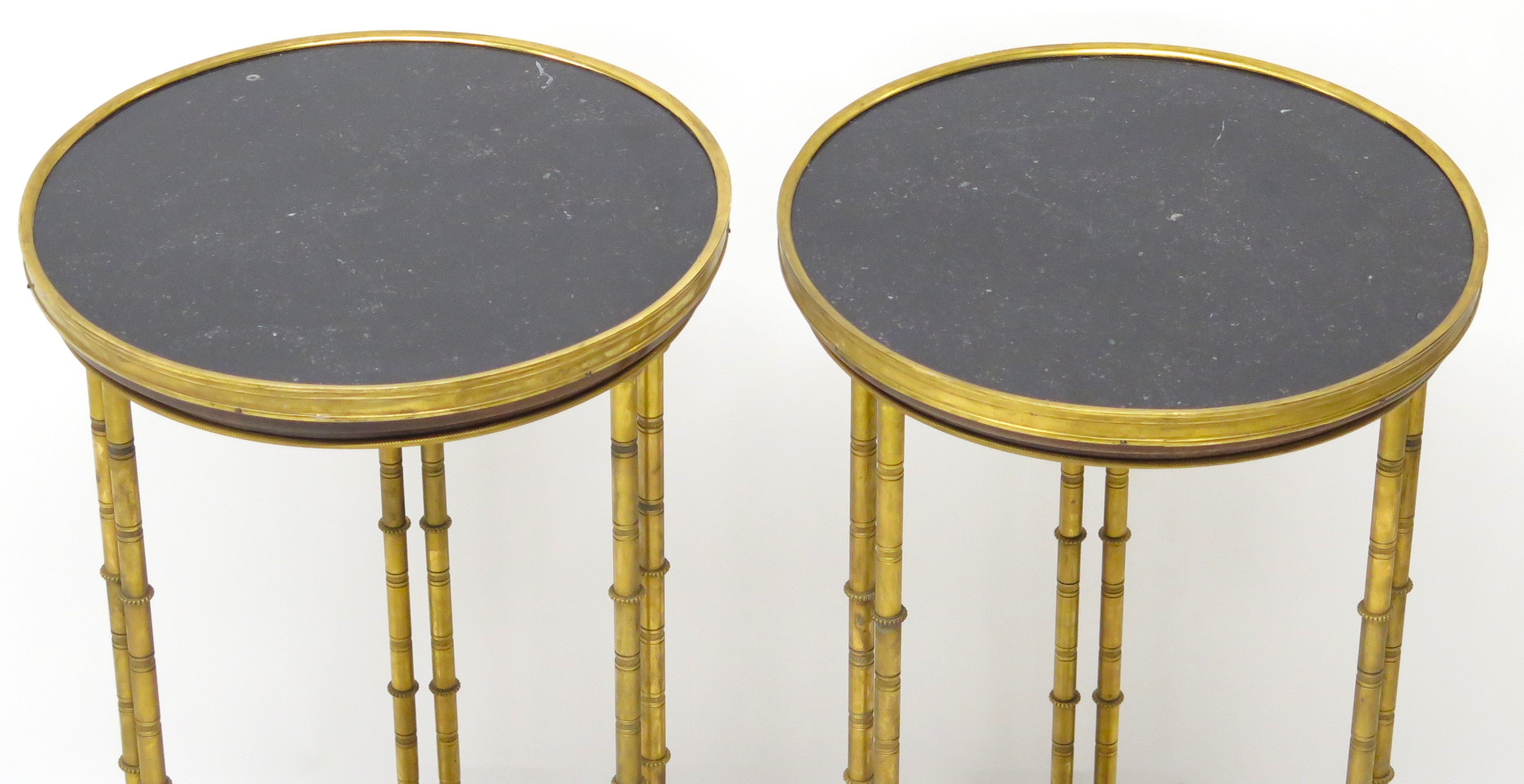 A pair of elegant Louis XVI-style gilt bronze gueridons